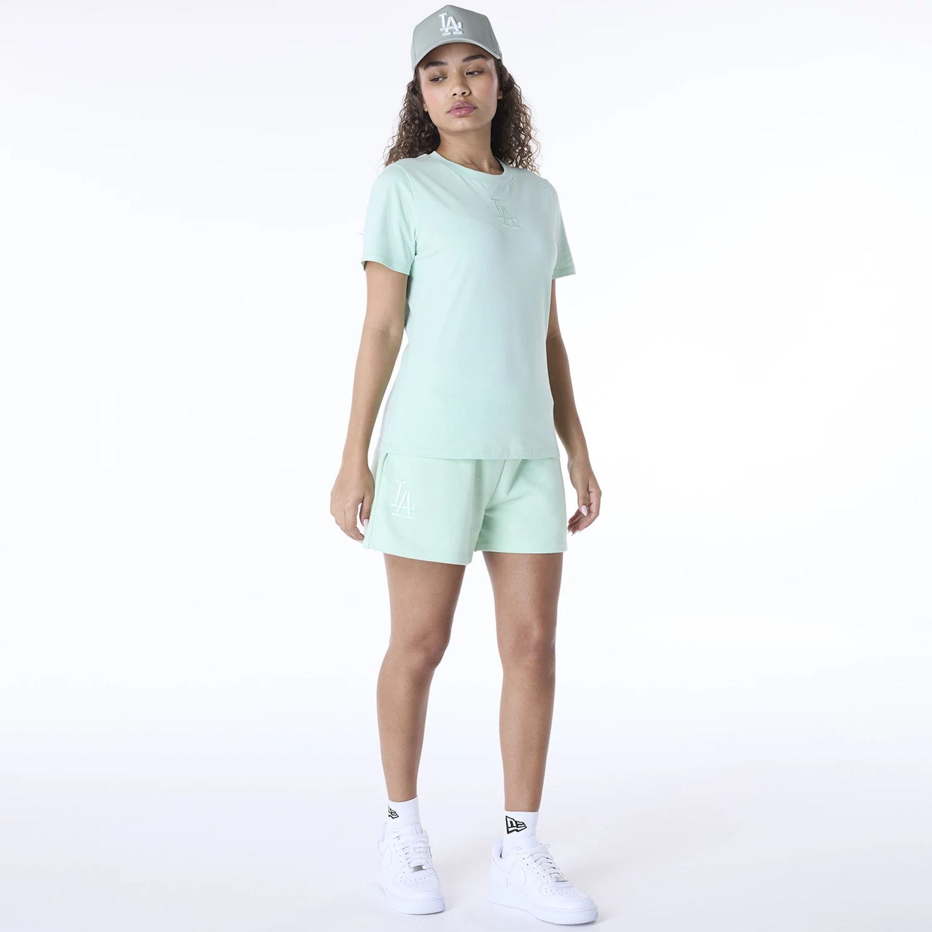 The Female model is wearing LA Dodgers Womens MLB League Essential Pastel Green Shorts 3