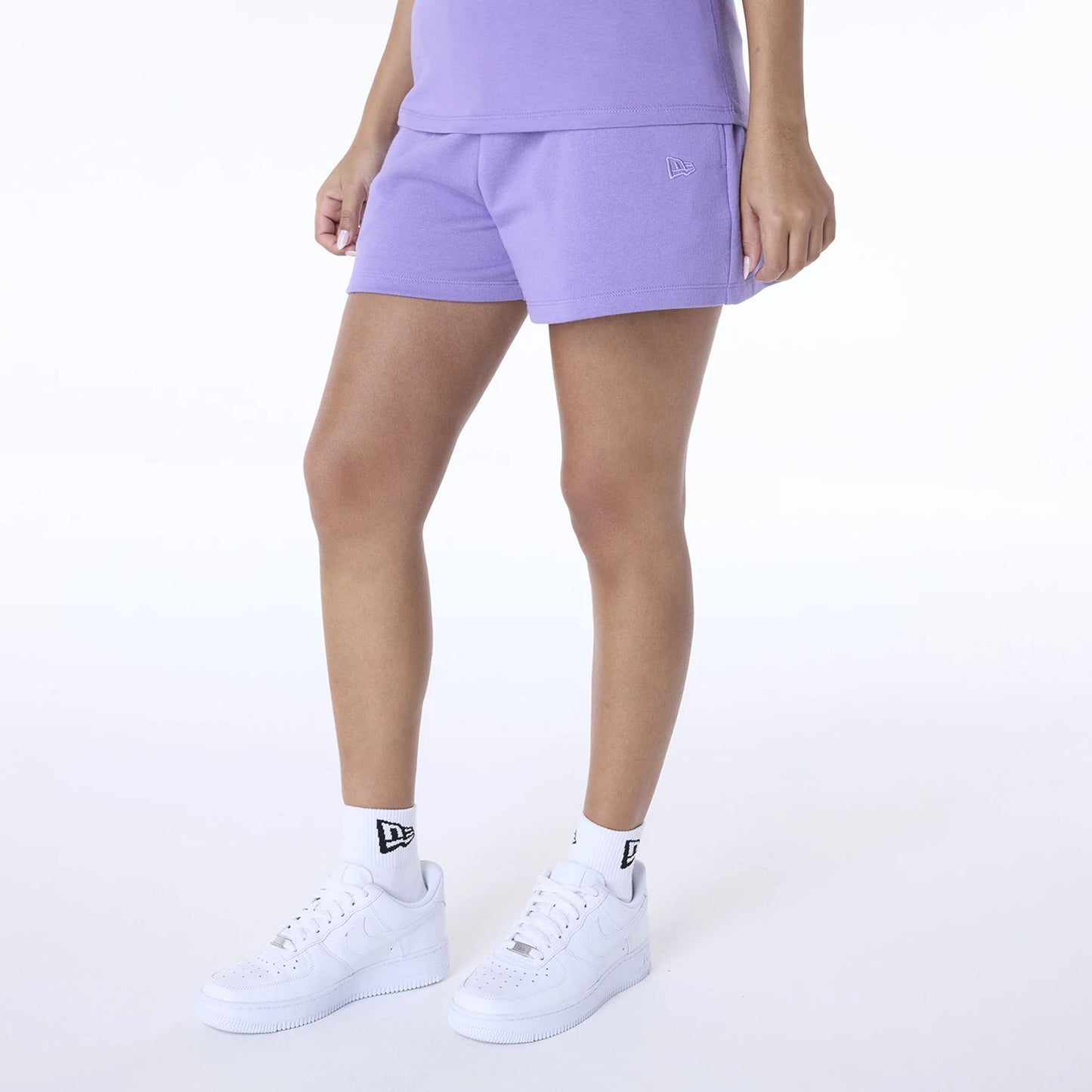 The Female model is wearing New York Yankees Womens MLB League Essential Purple Shorts 2