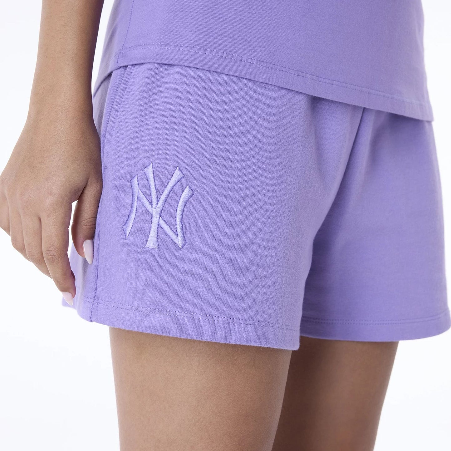 The Female model is wearing New York Yankees Womens MLB League Essential Purple Shorts 3