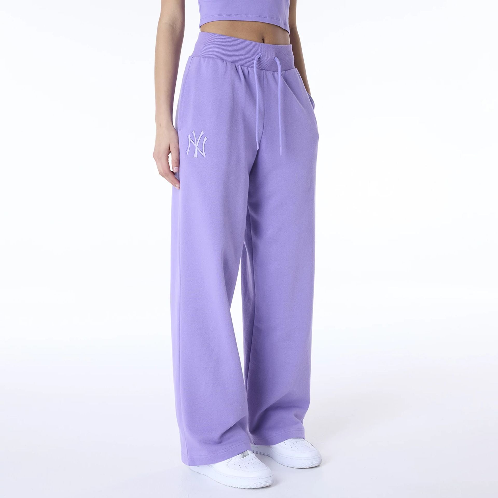 The Female model is wearing New York Yankees Womens MLB League Essential Purple Fleece Joggers 2