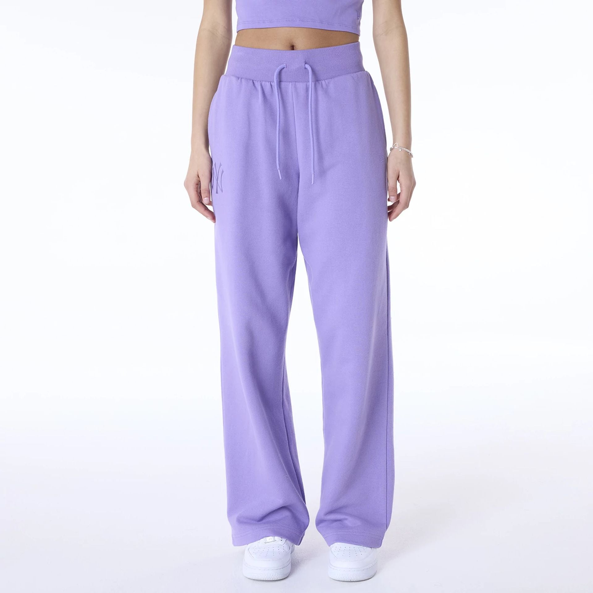 The Female model is wearing New York Yankees Womens MLB League Essential Purple Fleece Joggers 1