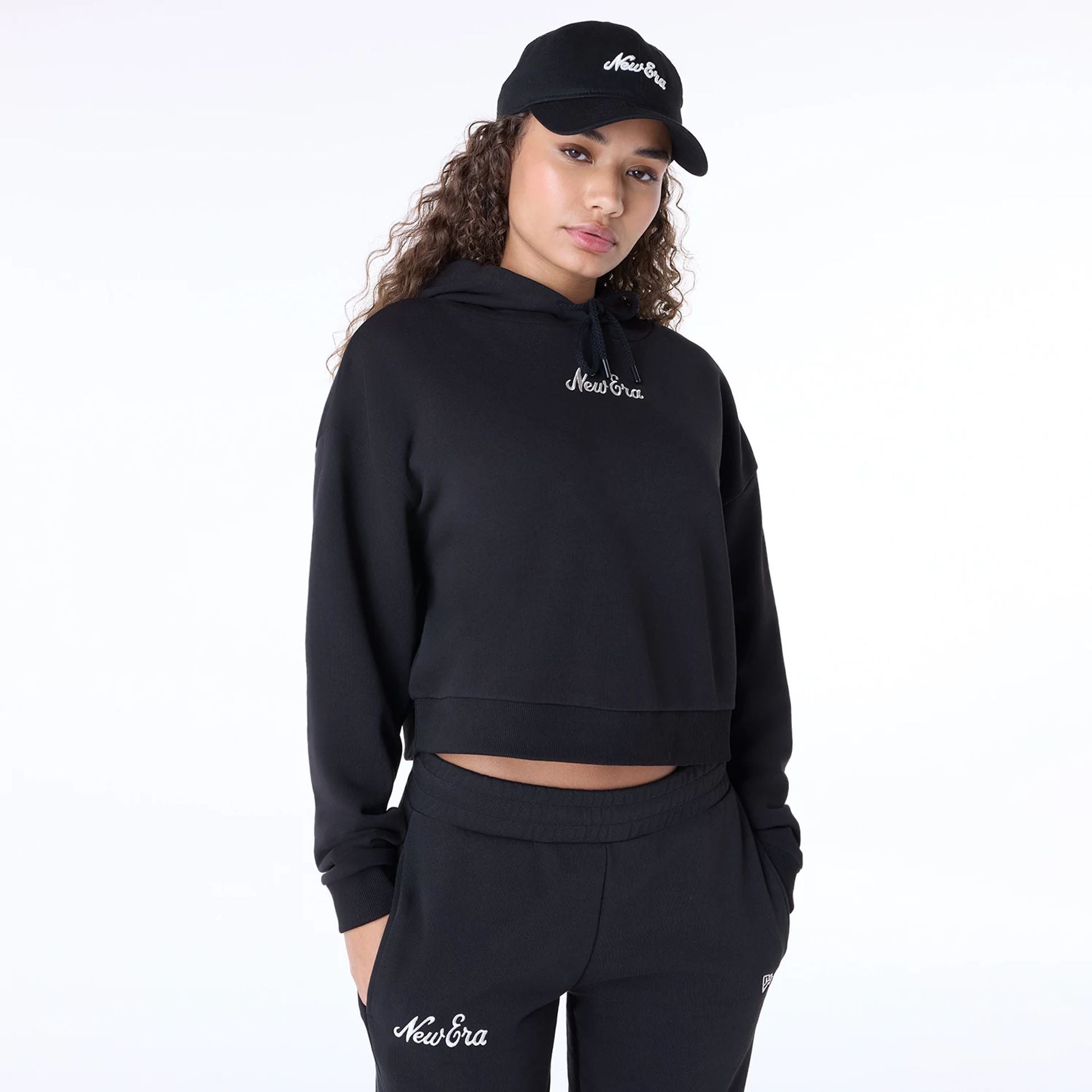 The Female model is wearing Womens New Era Script Black Pullover Hoodie 1