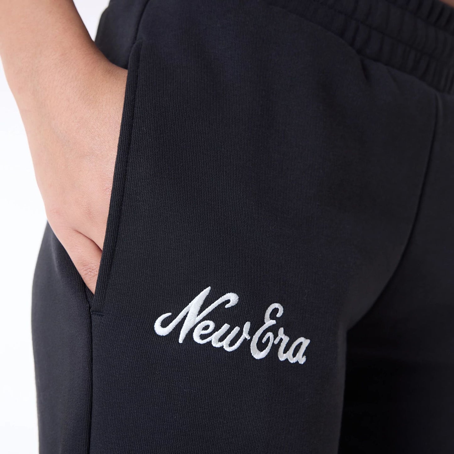 The Female model is wearing Womens New Era Script Black Joggers 5