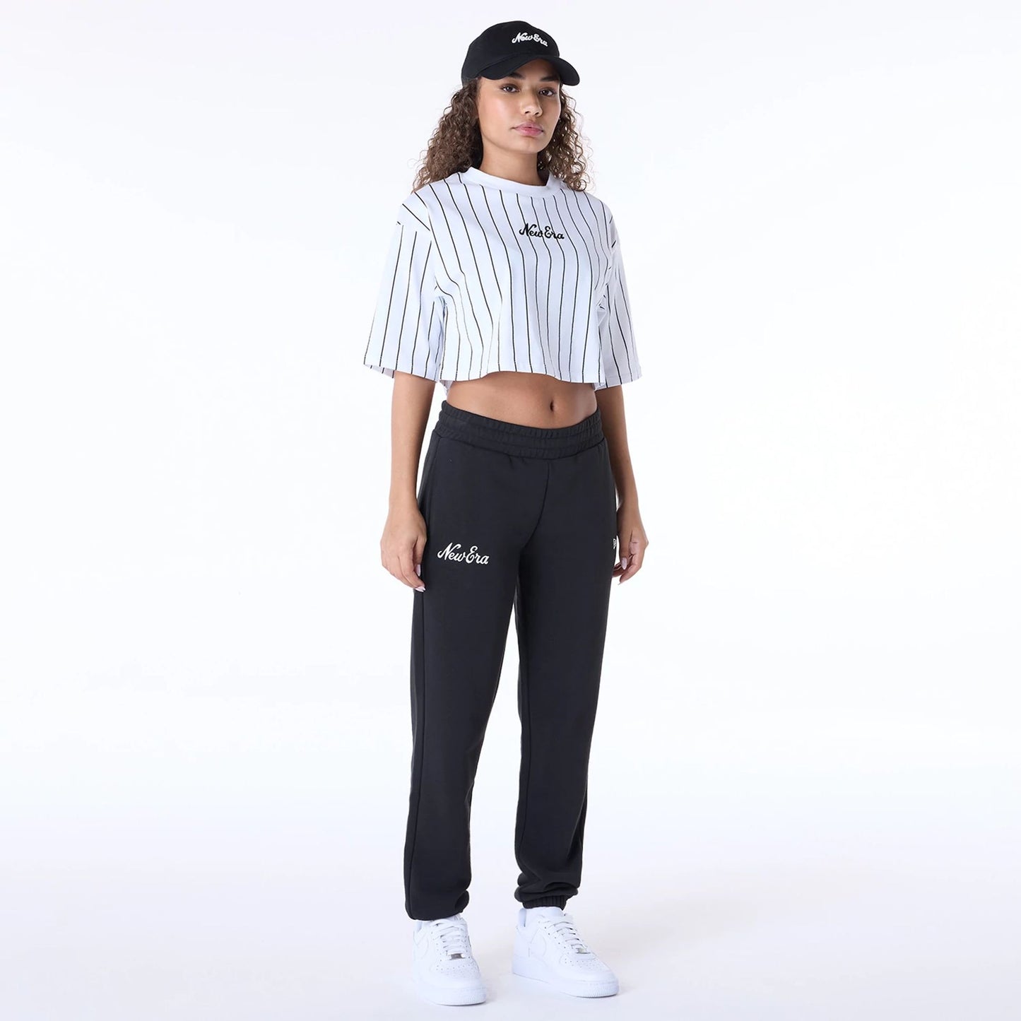 The Female model is wearing Womens New Era Script Black Joggers 8