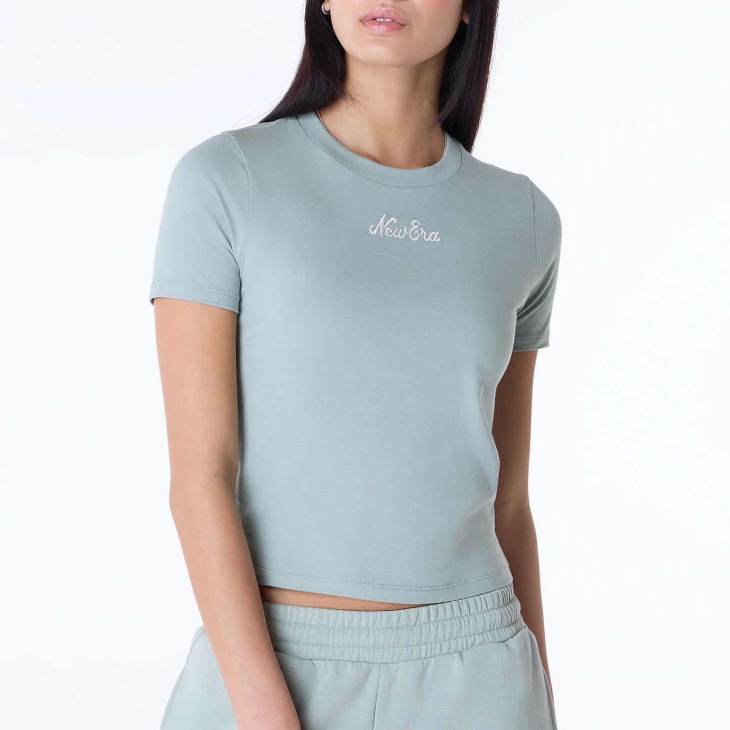 The Female model is wearing Womens New Era Slim Pastel Green T-Shirt 5