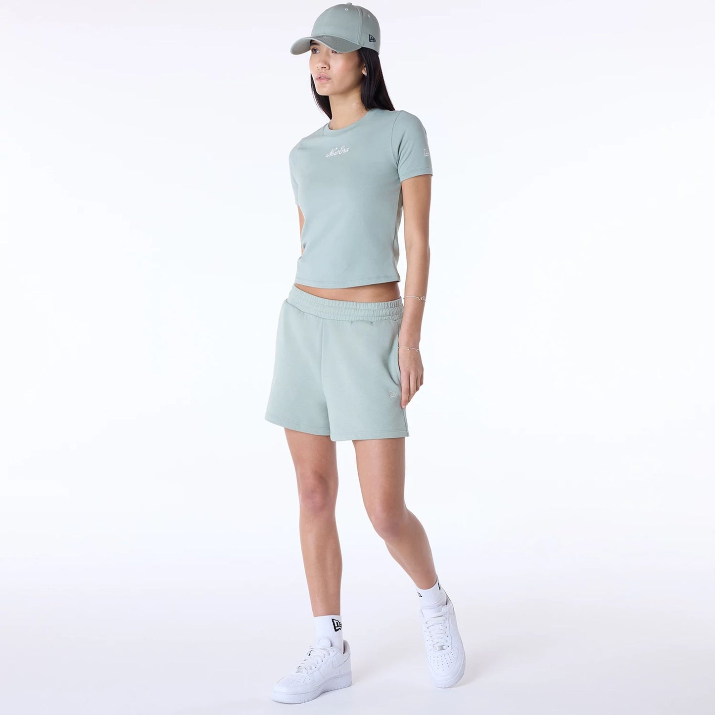 The Female model is wearing Womens New Era Slim Pastel Green T-Shirt 8