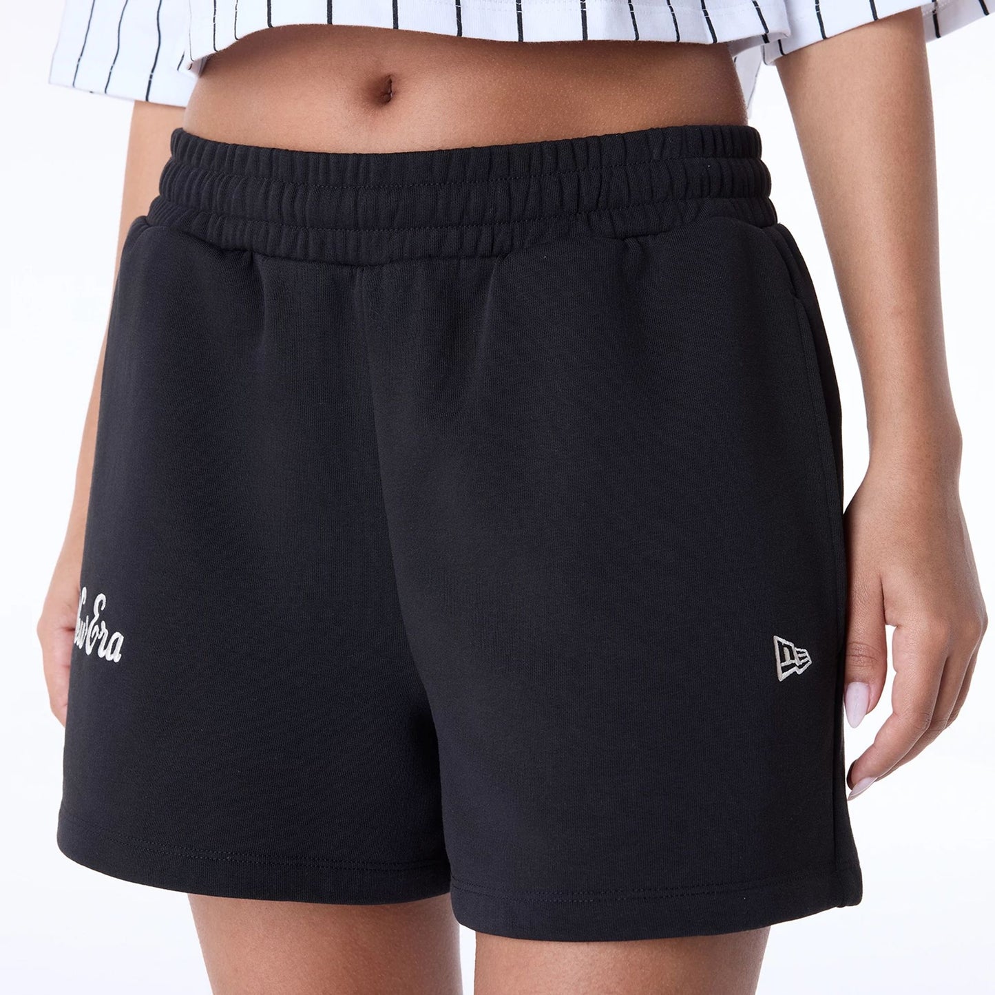 The Female model is wearing Womens New Era Script Black Shorts 3