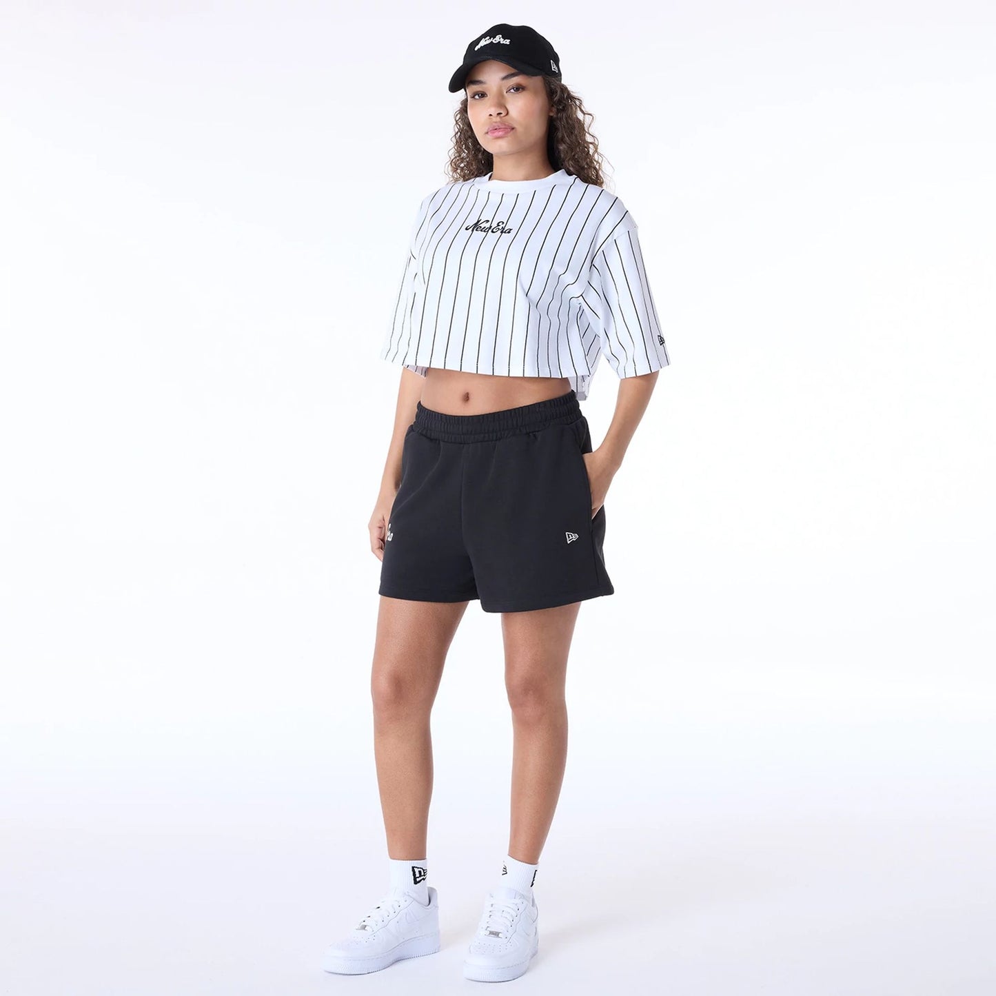 The Female model is wearing Womens New Era Script Black Shorts 8