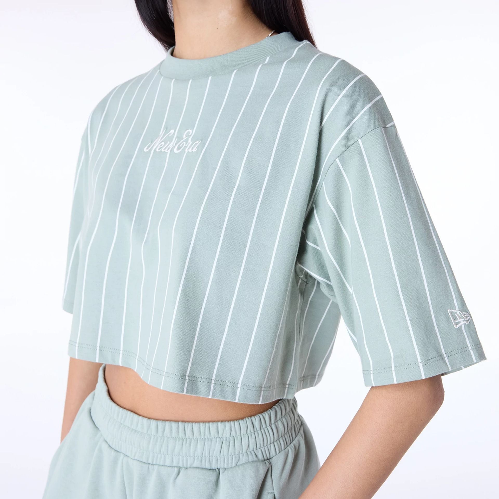 The Female model is wearing Womens New Era Pinstripe Pastel Green T-Shirt 3