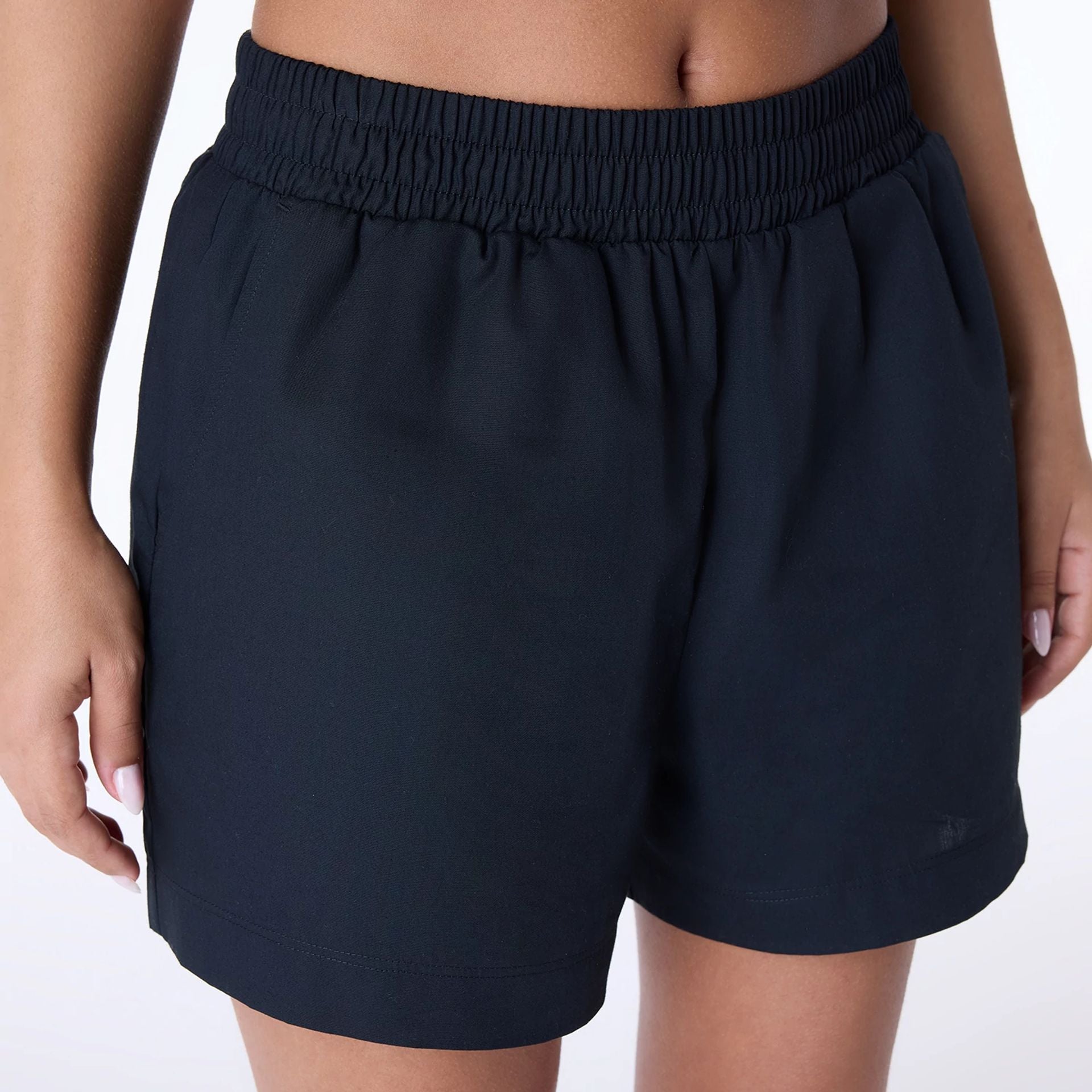 The Female model is wearing Womens New Era Cotton Black Shorts 3