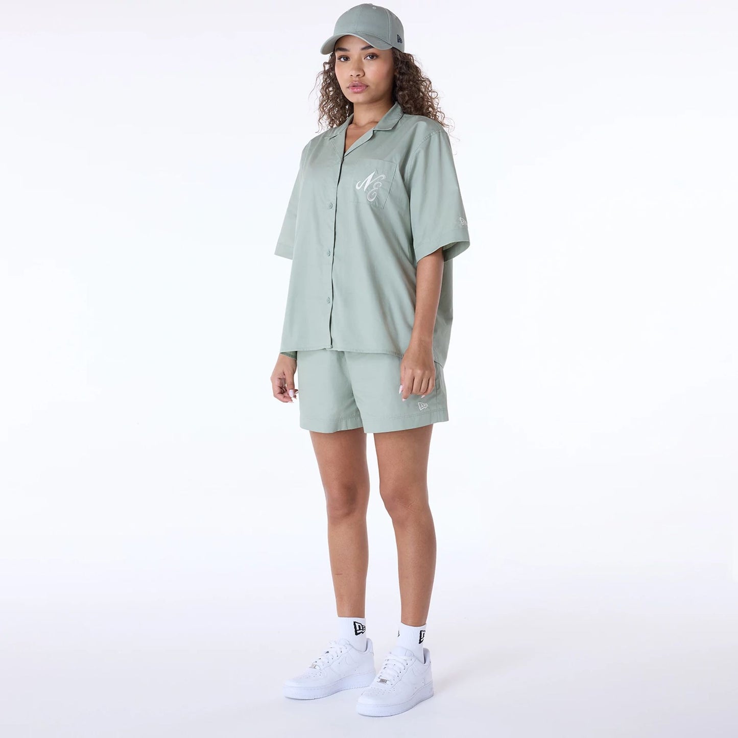 The Female model is wearing Womens New Era Revere Pastel Green T-Shirt 8