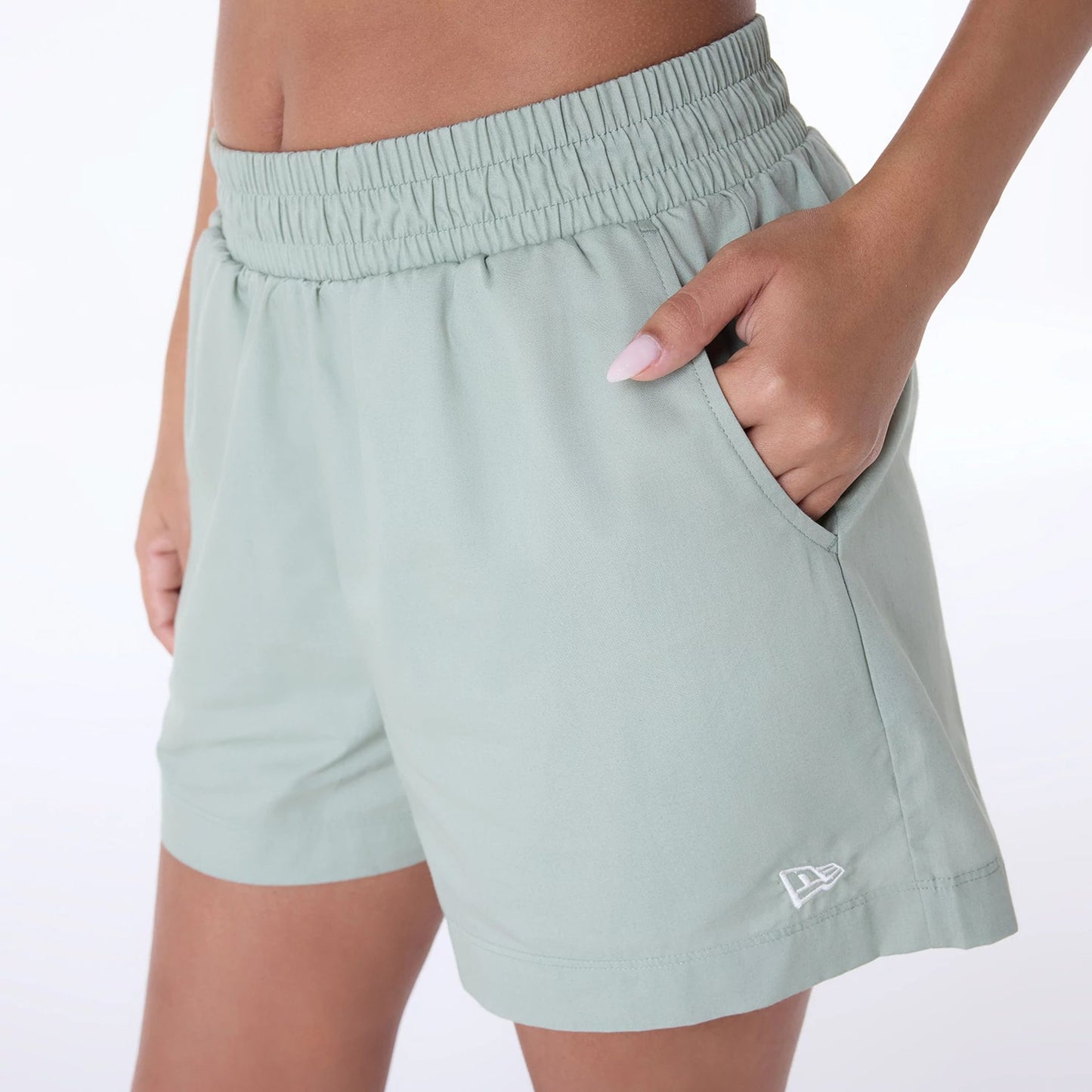 The Female model is wearing Womens New Era Cotton Pastel Green Shorts 5