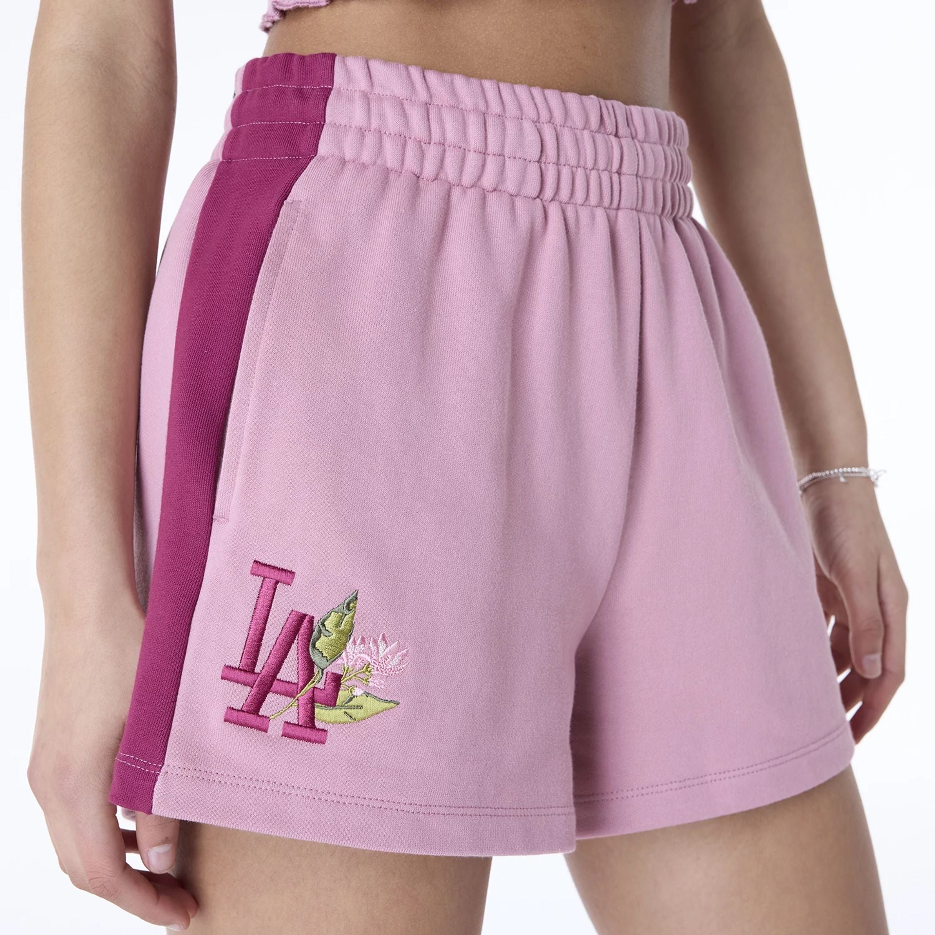 The Female model is wearing LA Dodgers Womens MLB Dark Pink Shorts 2