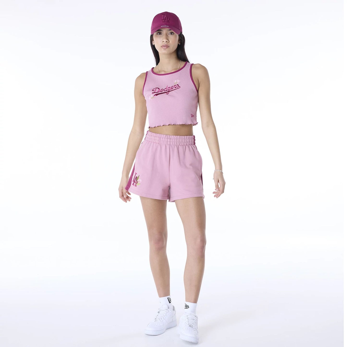 The Female model is wearing LA Dodgers Womens MLB Dark Pink Shorts 7