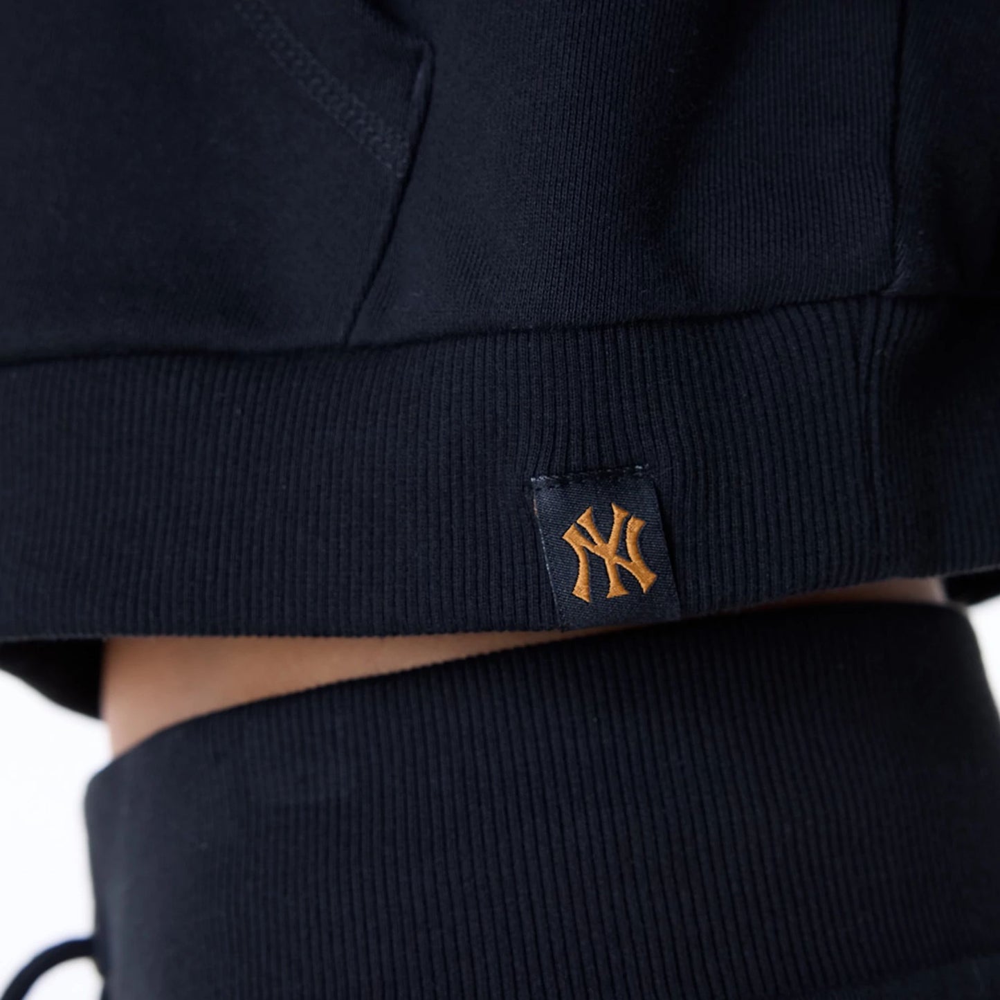 The Female model is wearing New York Yankees Womens MLB Graphic Black Pullover Hoodie 5