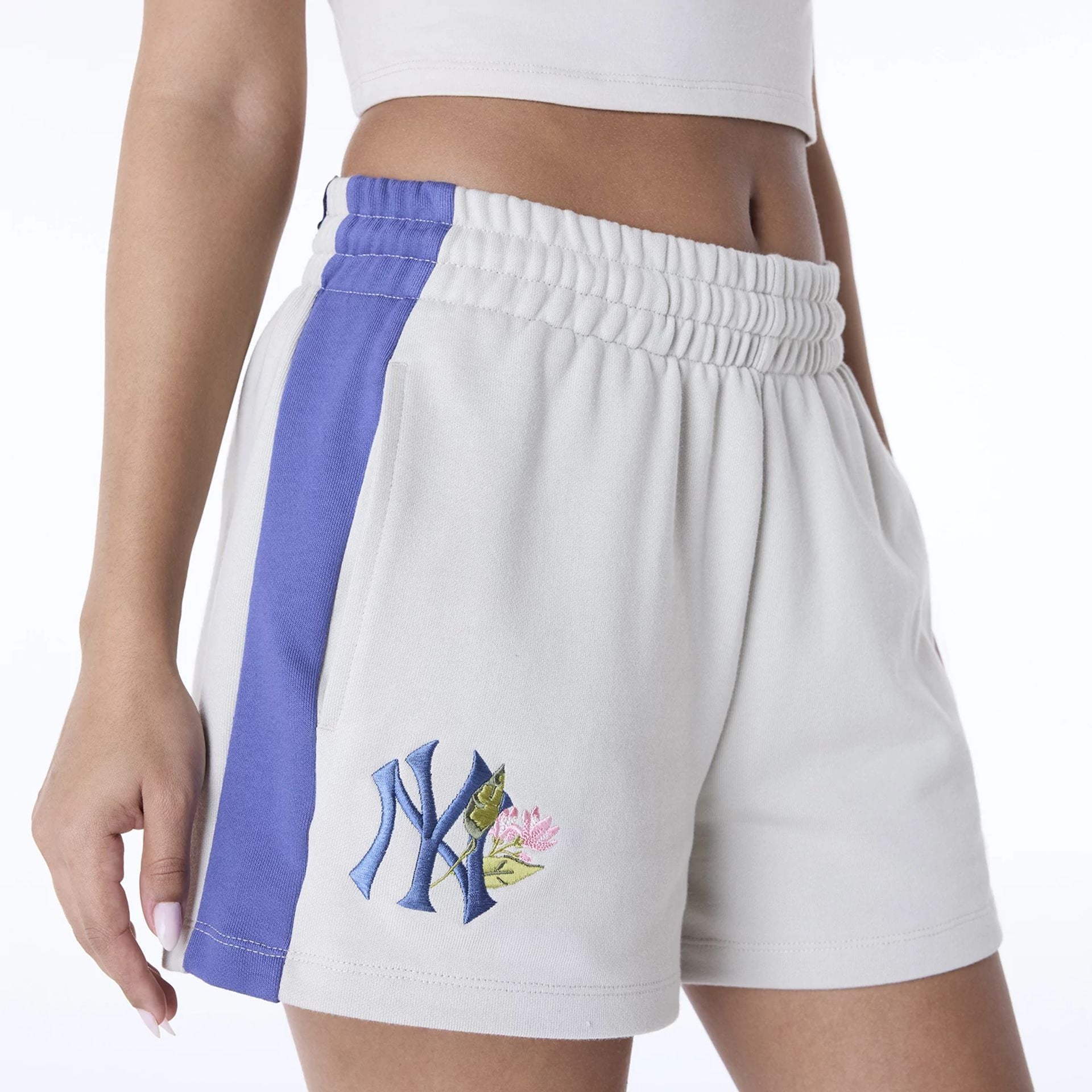 The Female model is wearing New York Yankees Womens MLB Floral Light Beige Shorts 7