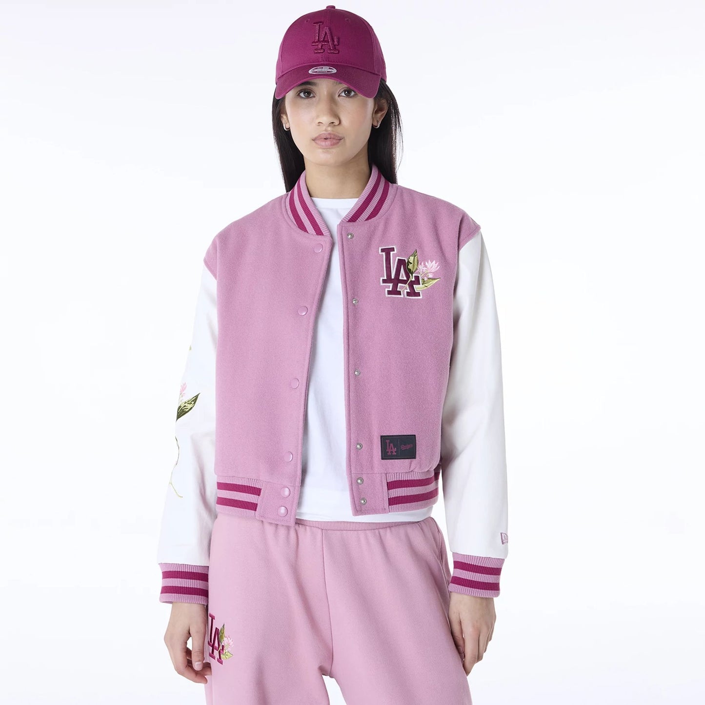 The Female model is wearing LA Dodgers Womens MLB Floral Dark Pink Varsity Jacket 1