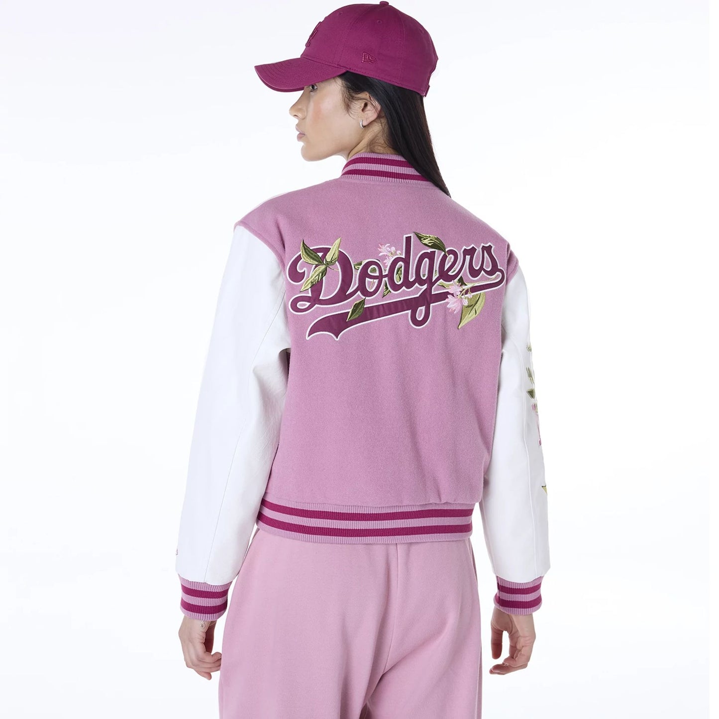 The Female model is wearing LA Dodgers Womens MLB Floral Dark Pink Varsity Jacket 2