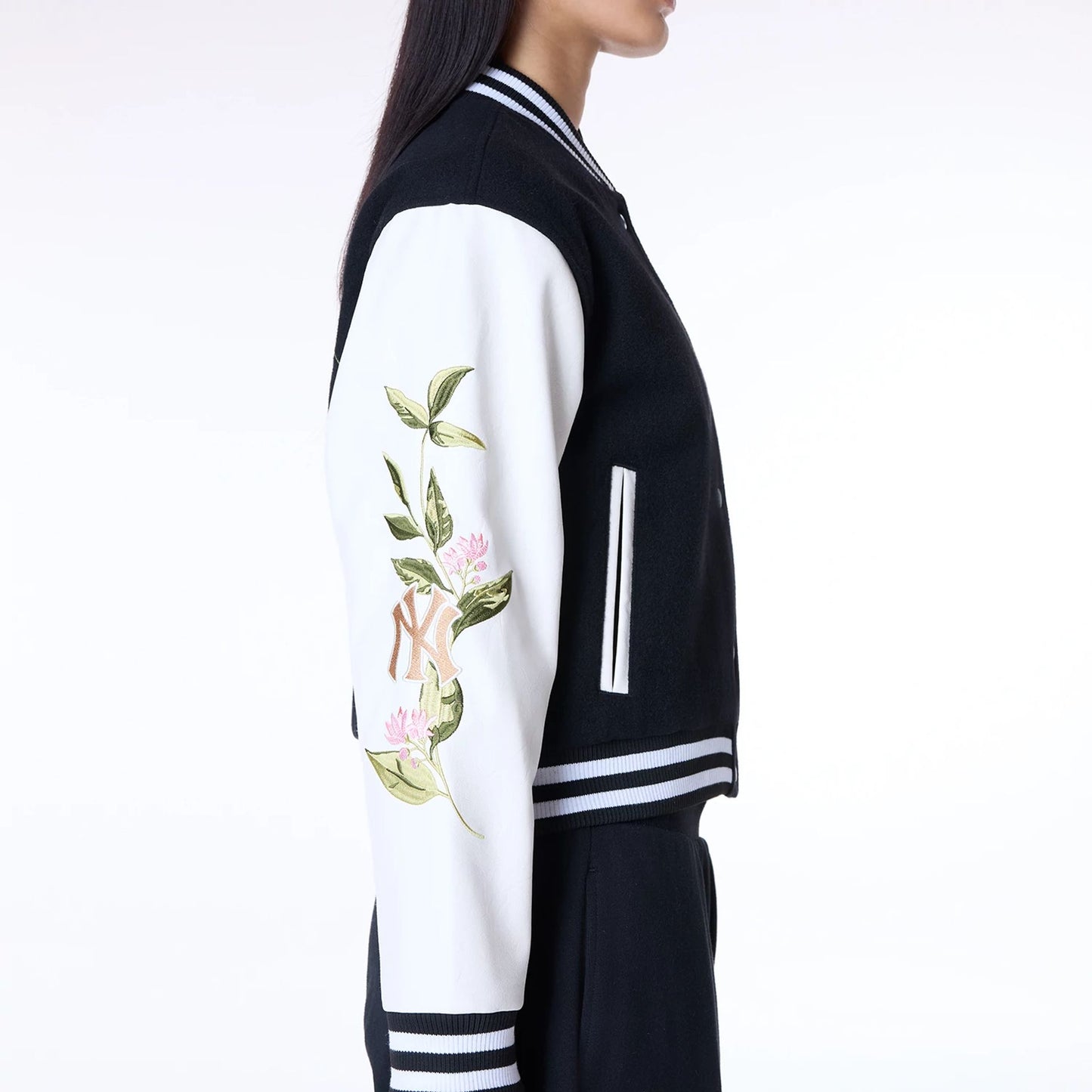 The Female model is wearing New York Yankees Womens MLB Floral Black Varsity Jacket 5