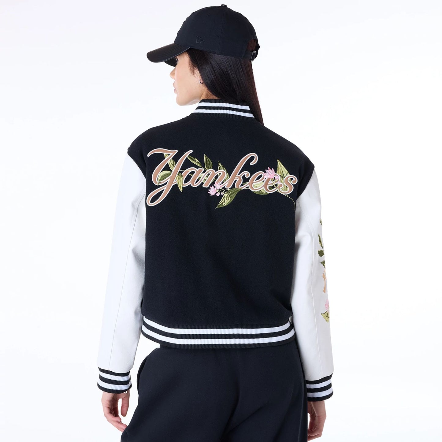 The Female model is wearing New York Yankees Womens MLB Floral Black Varsity Jacket 7