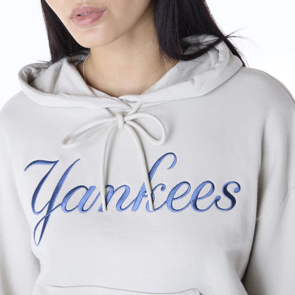 The Female model is wearing New York Yankees Womens MLB Graphic Light Beige Pullover Hoodie 8