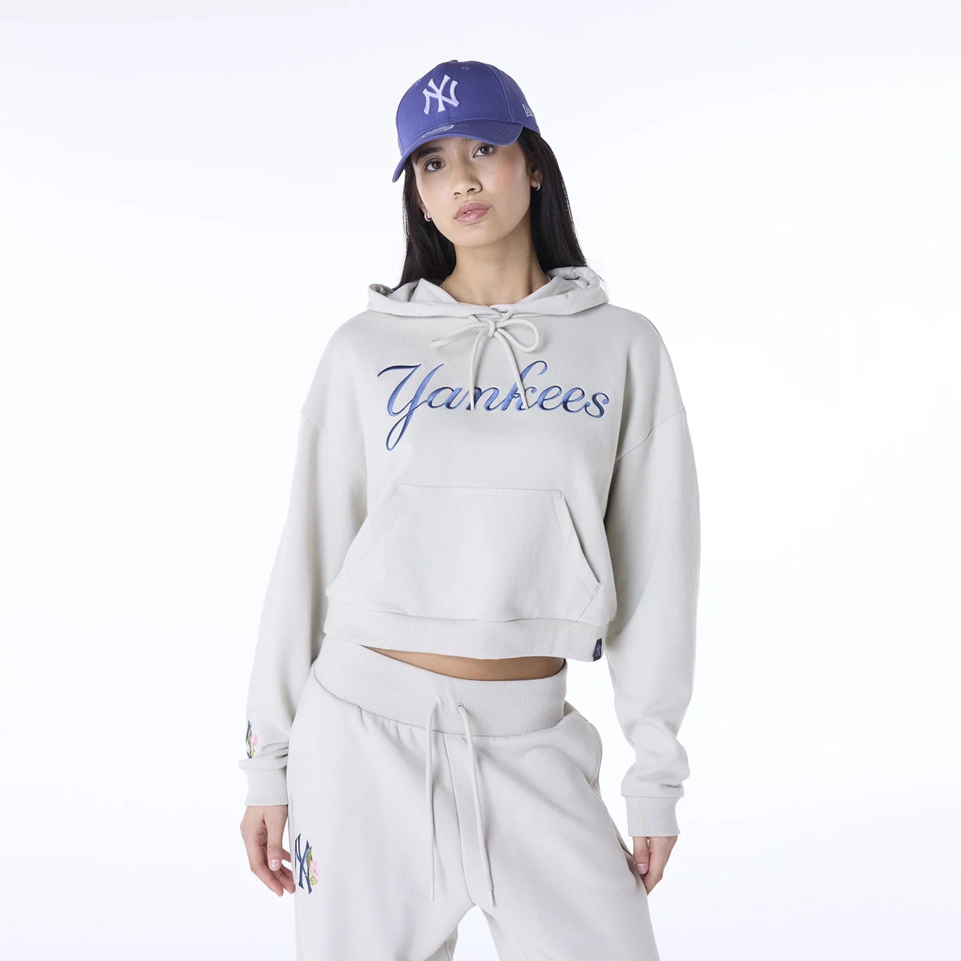 The Female model is wearing New York Yankees Womens MLB Graphic Light Beige Pullover Hoodie 1