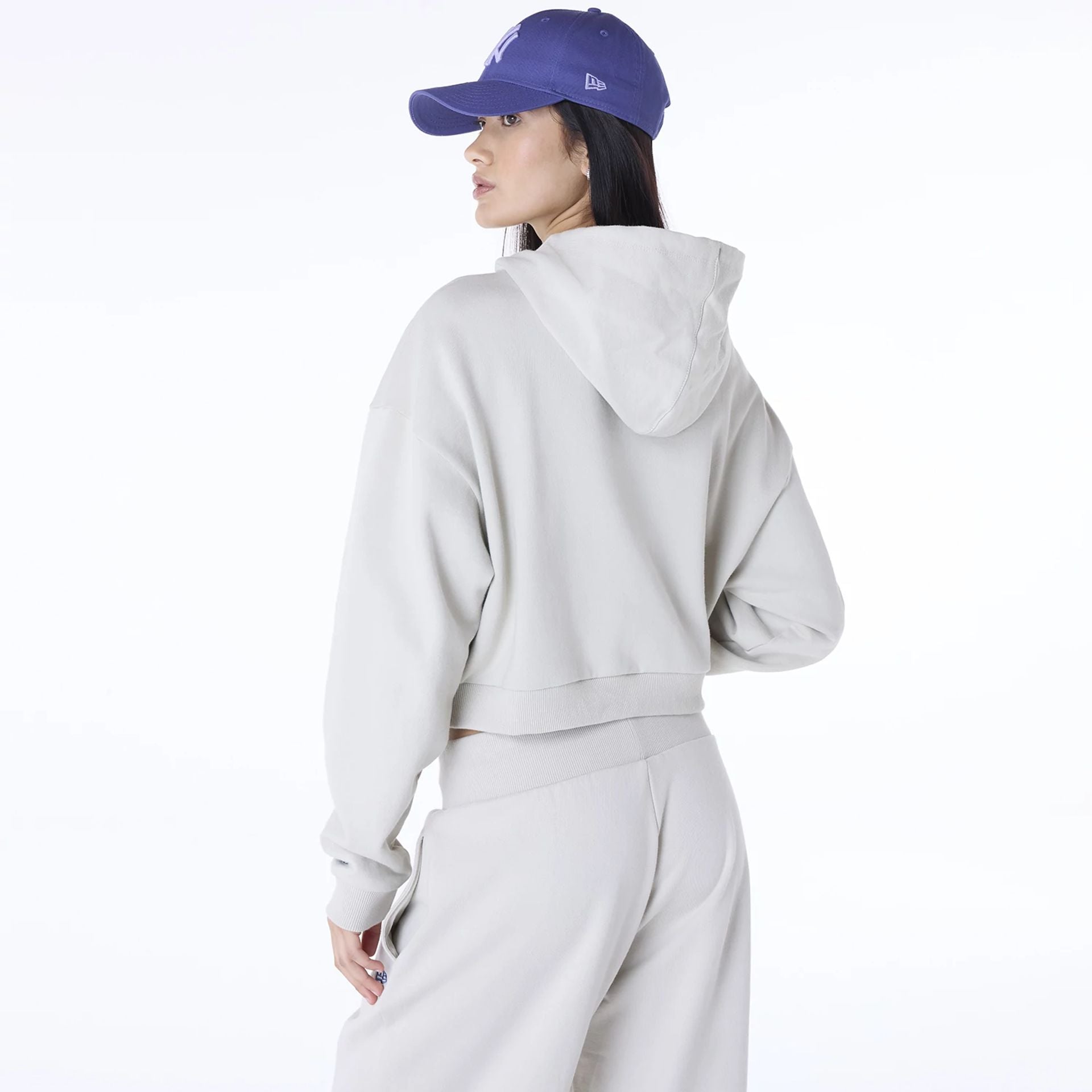 The Female model is wearing New York Yankees Womens MLB Graphic Light Beige Pullover Hoodie 2