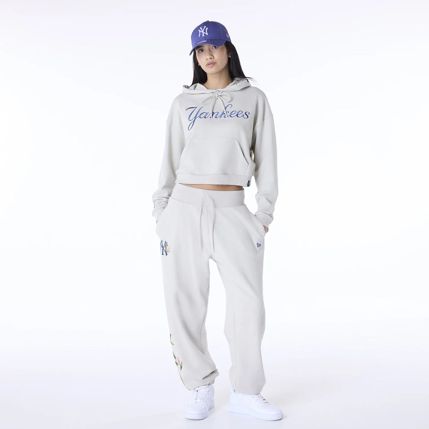 The Female model is wearing New York Yankees Womens MLB Graphic Light Beige Pullover Hoodie 3