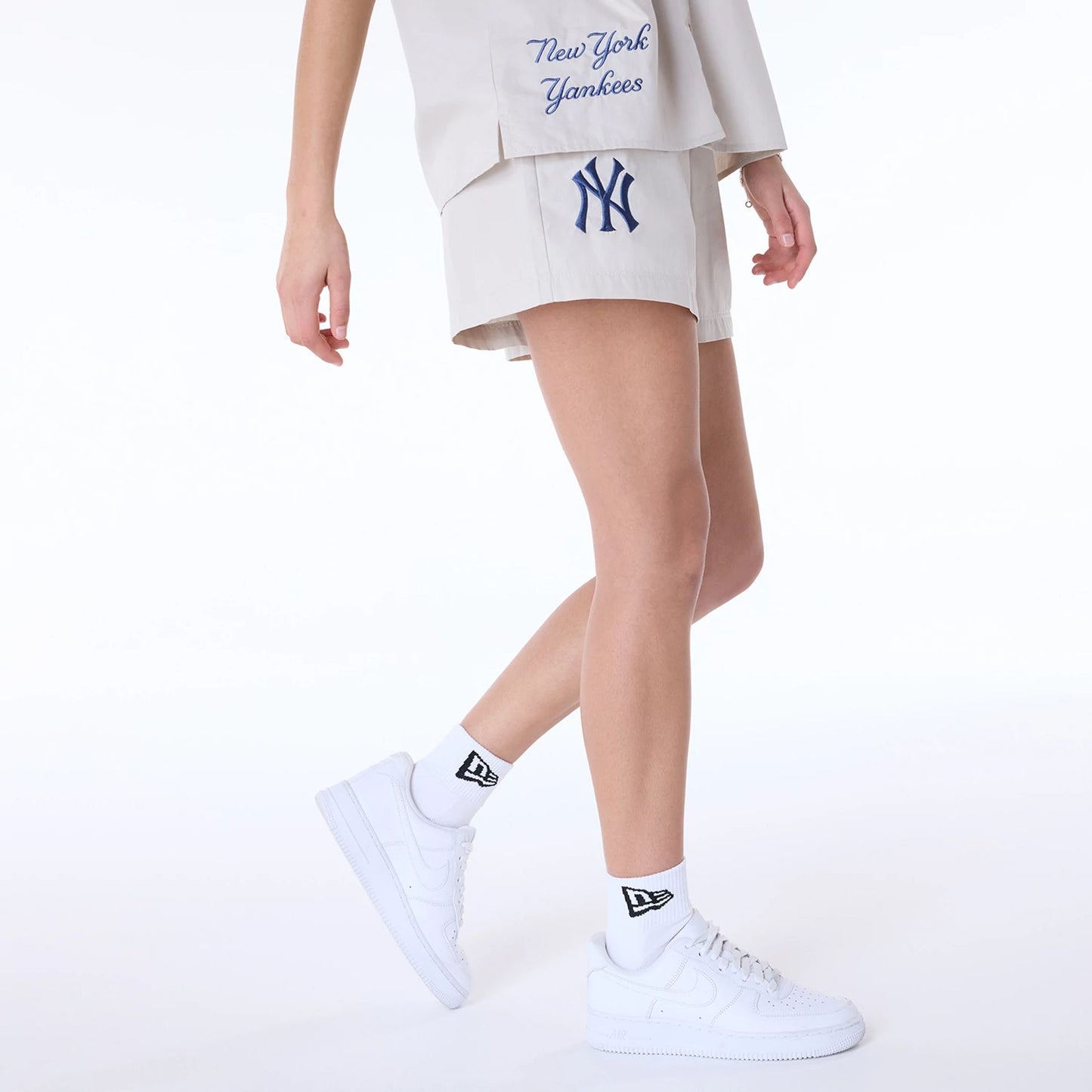 The Female model is wearing New York Yankees Womens MLB Light Beige Shorts 8