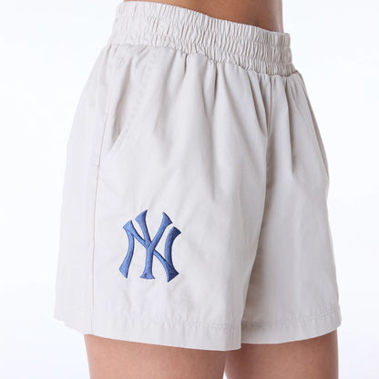 The Female model is wearing New York Yankees Womens MLB Light Beige Shorts 2