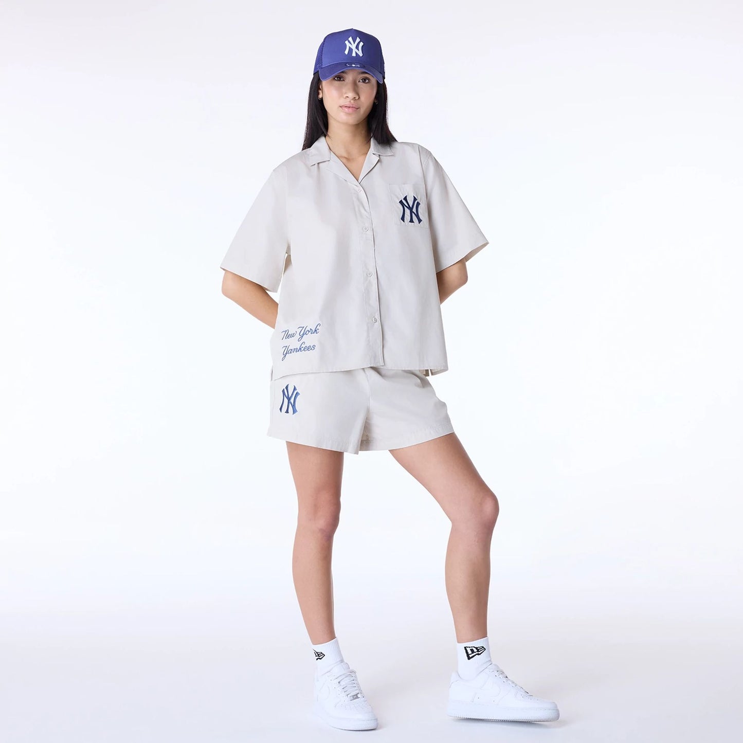 The Female model is wearing New York Yankees Womens MLB Light Beige Shorts 4