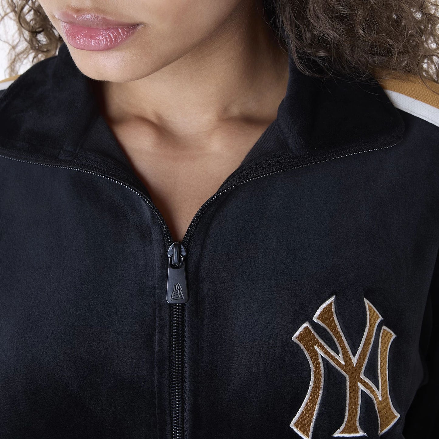 The Female model is wearing New York Yankees Womens MLB Velour Black Track Jacket 3