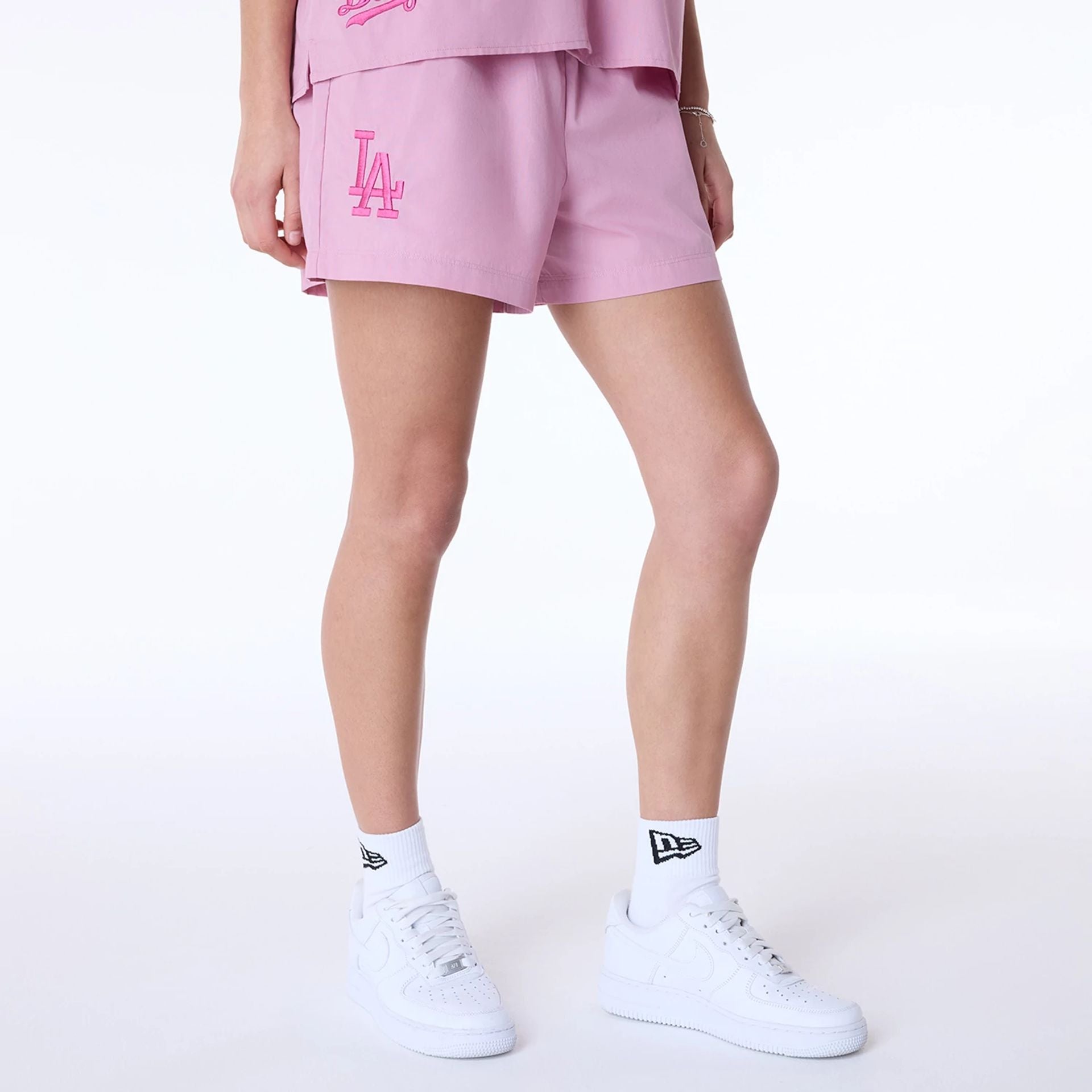 The Female model is wearing LA Dodgers Womens MLB Dark Pink Shorts 1