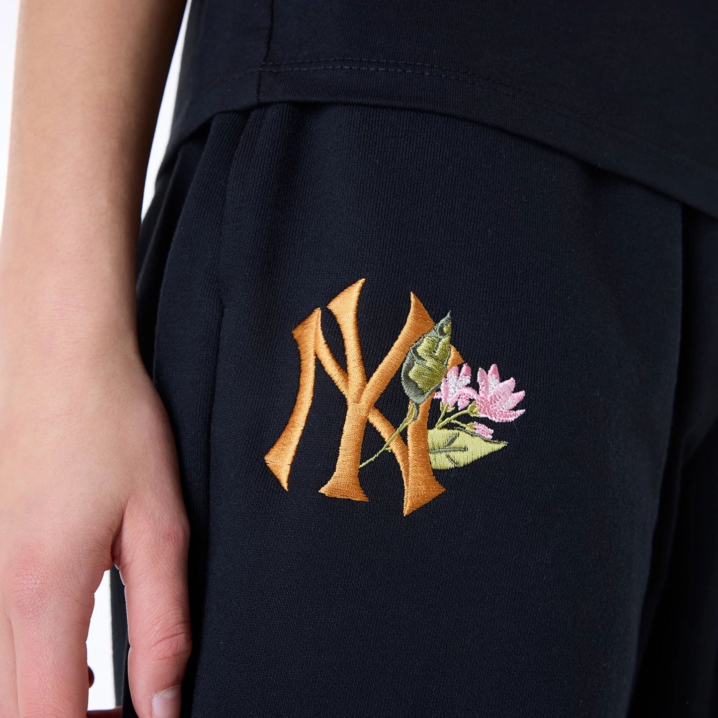 The Female model is wearing New York Yankees Womens MLB Floral Black Joggers 4