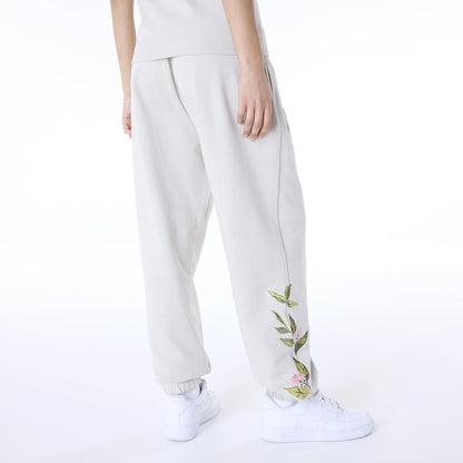 The Female model is wearing New York Yankees Womens MLB Floral Light Beige Joggers 6