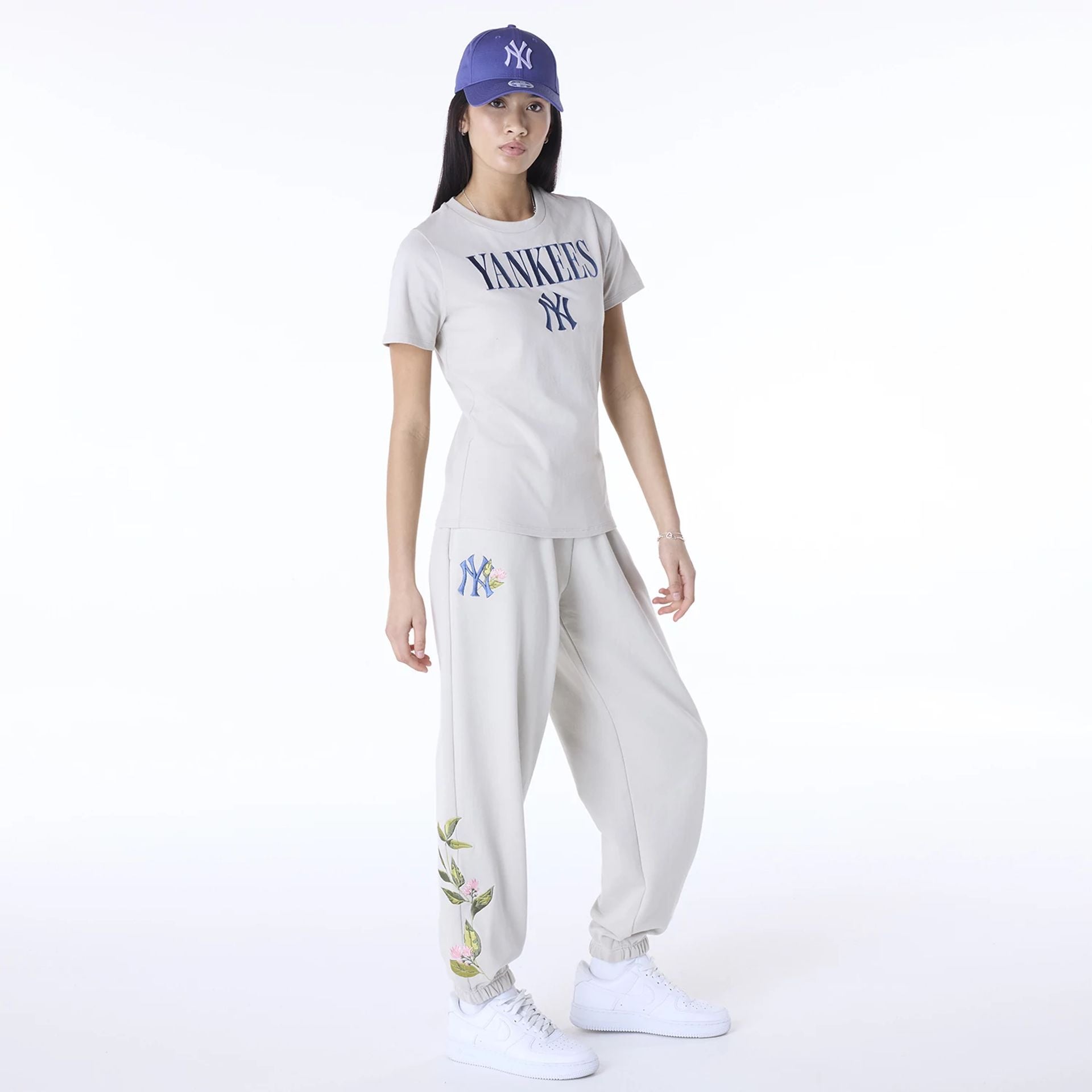 The Female model is wearing New York Yankees Womens MLB Floral Light Beige Joggers 3