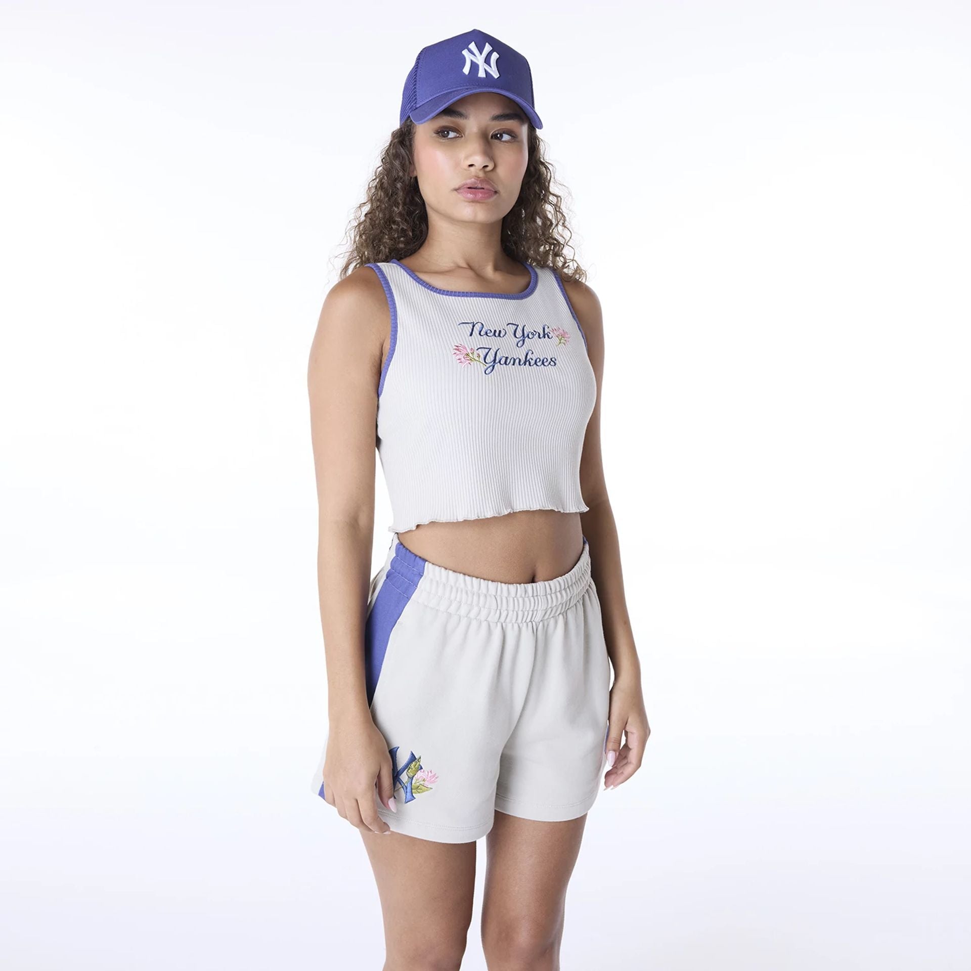 The Female model is wearing New York Yankees Womens MLB Floral Light Beige Vest 1