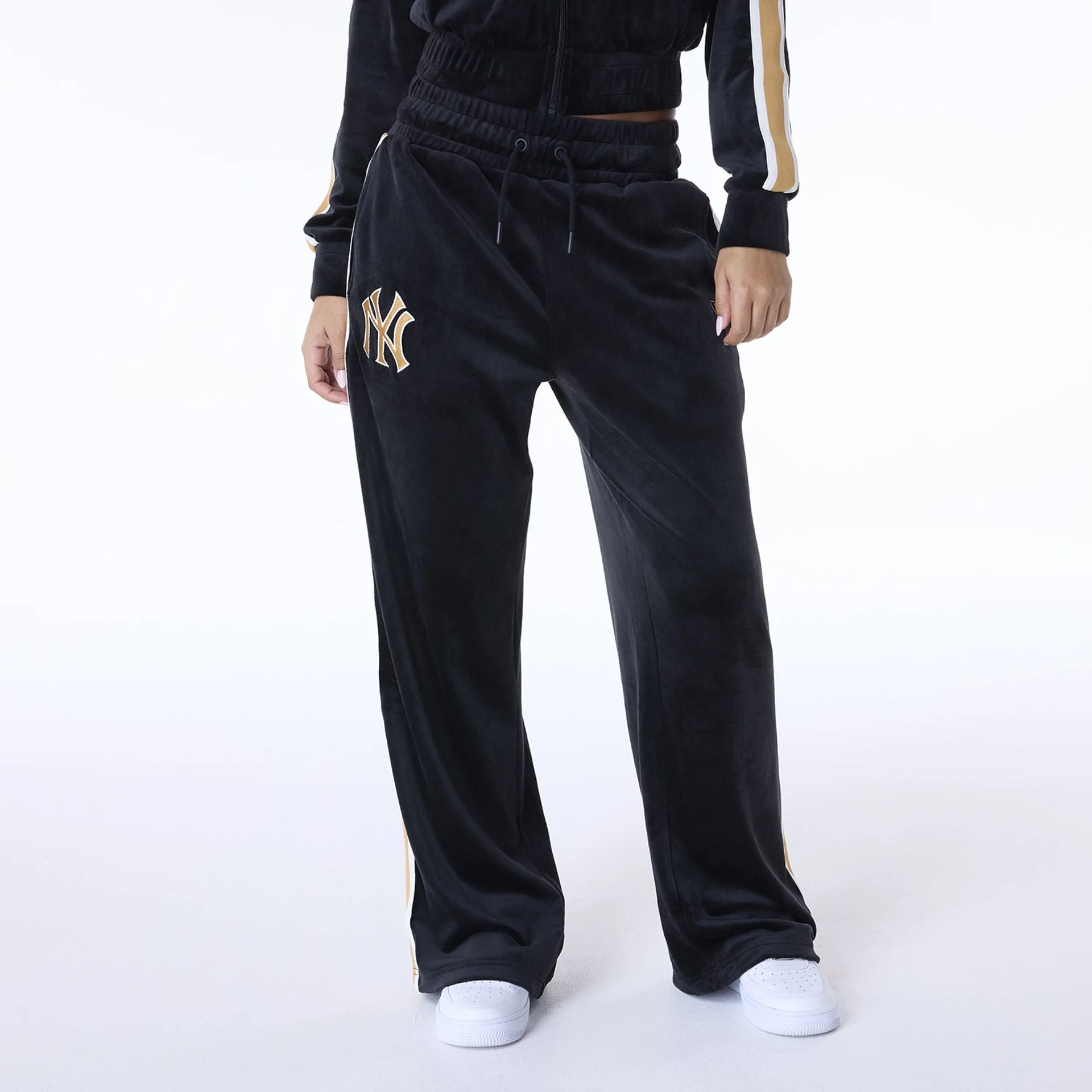 The Female model is wearing New York Yankees Womens MLB Velour Black Joggers 1