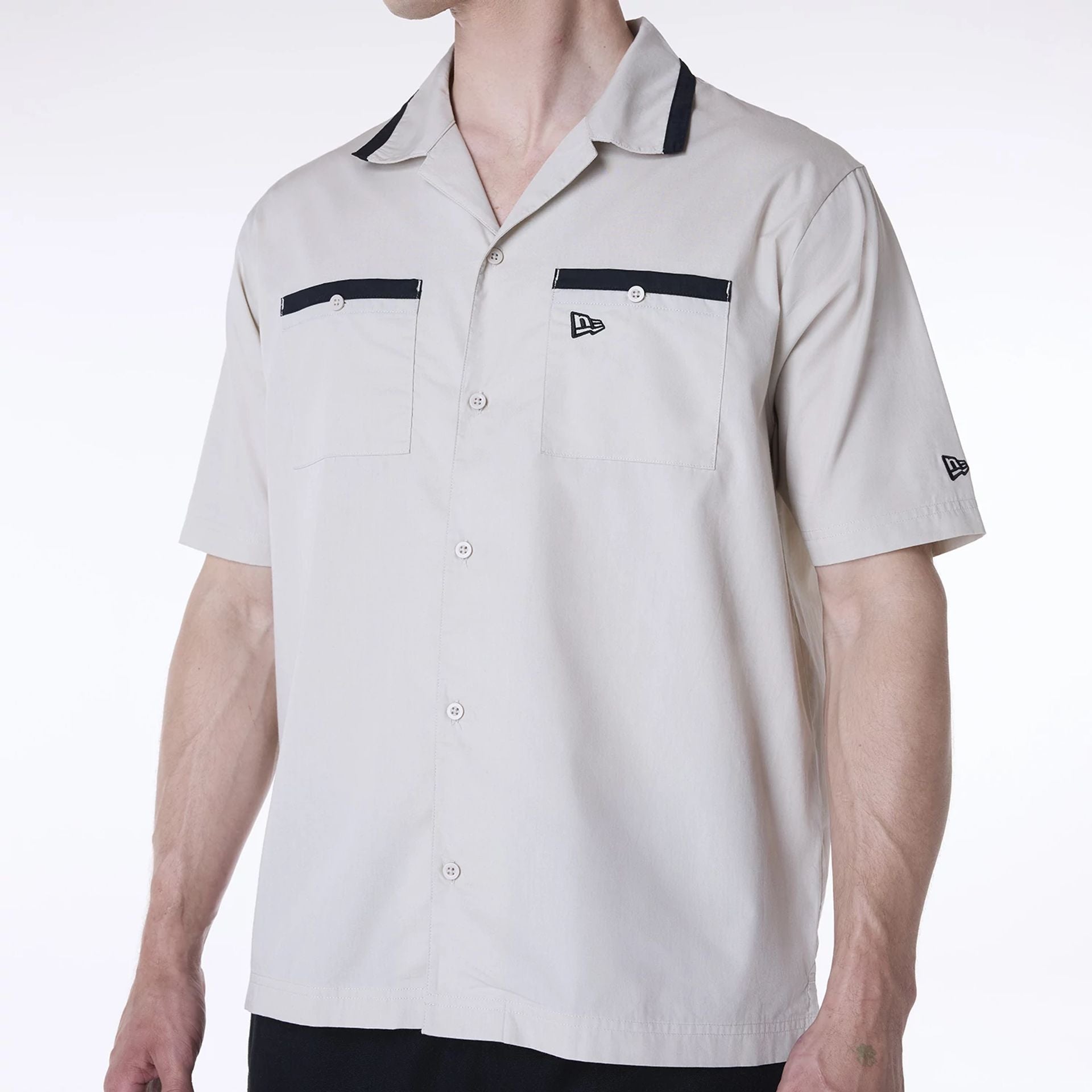 The Male model is wearing New Era Revere Cream Short Sleeve Shirt 2