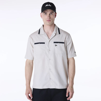 The Male model is wearing New Era Revere Cream Short Sleeve Shirt 1