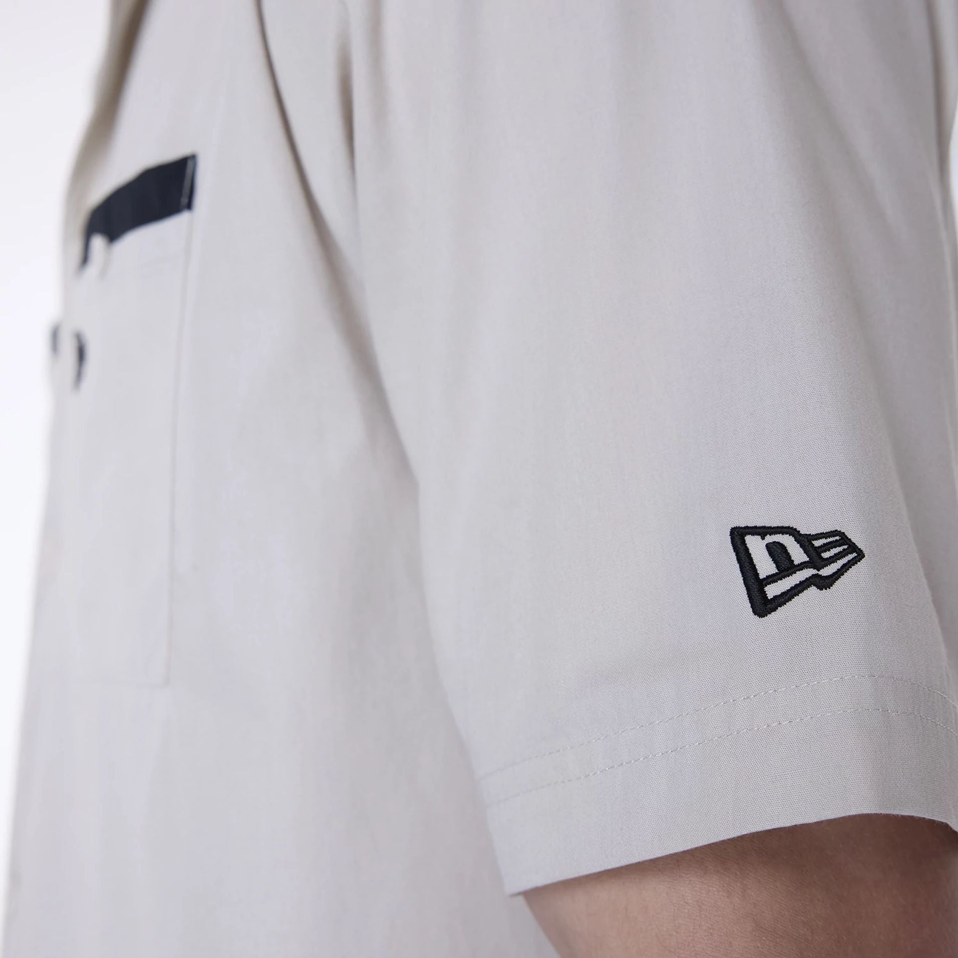 The Male model is wearing New Era Revere Cream Short Sleeve Shirt 7