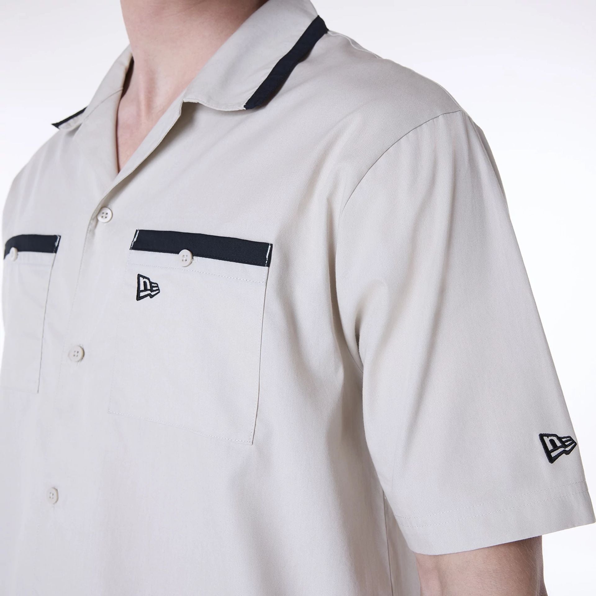 The Male model is wearing New Era Revere Cream Short Sleeve Shirt 4