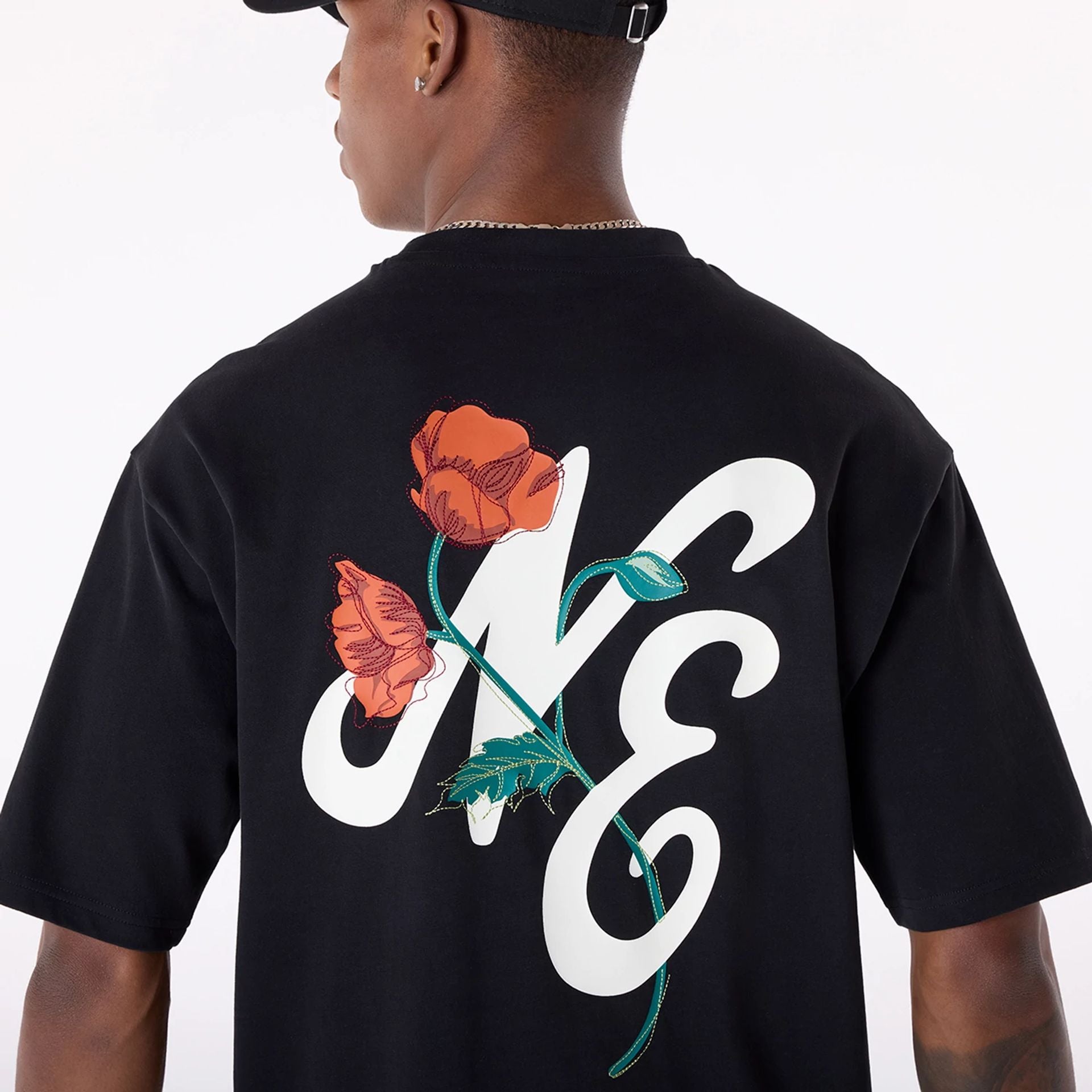 The Male model is wearing New Era Floral Graphic Black T-Shirt 5