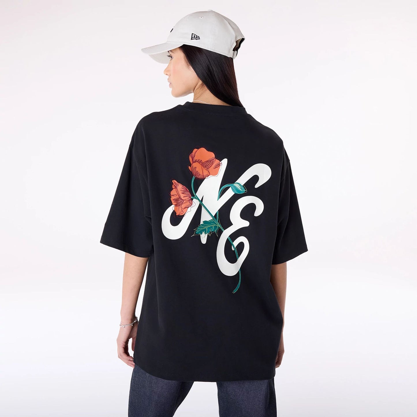 The Male model is wearing New Era Floral Graphic Black T-Shirt 4