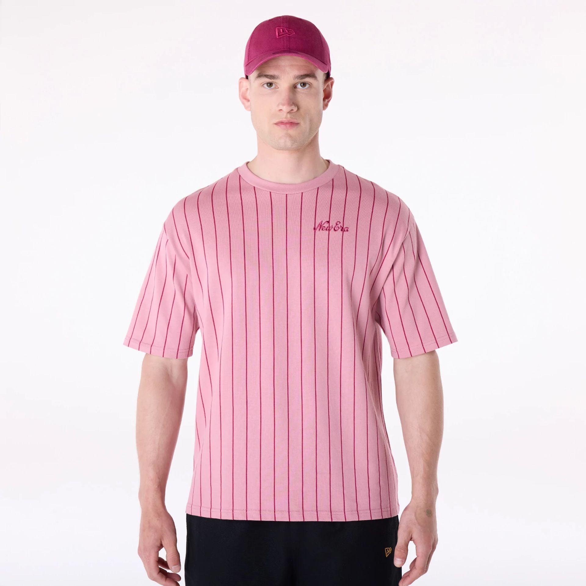 The Male model is wearing New Era Pinstripe Dark Pink Oversized T-Shirt 1