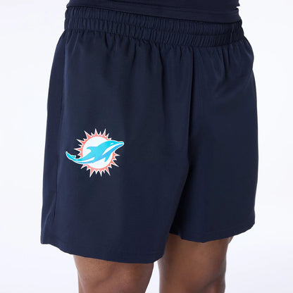 The Male model is wearing Miami Dolphins NFL Essentials Navy Shorts 5