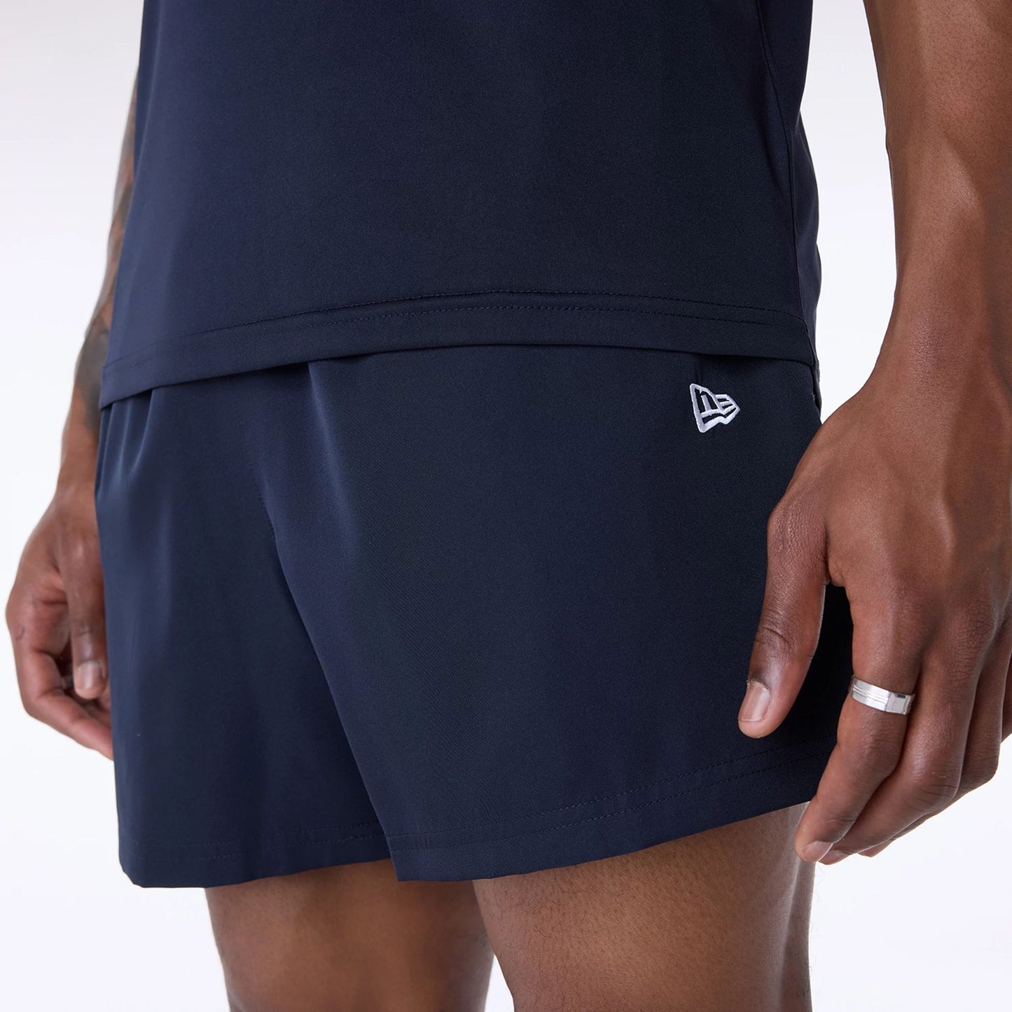 The Male model is wearing Miami Dolphins NFL Essentials Navy Shorts 3