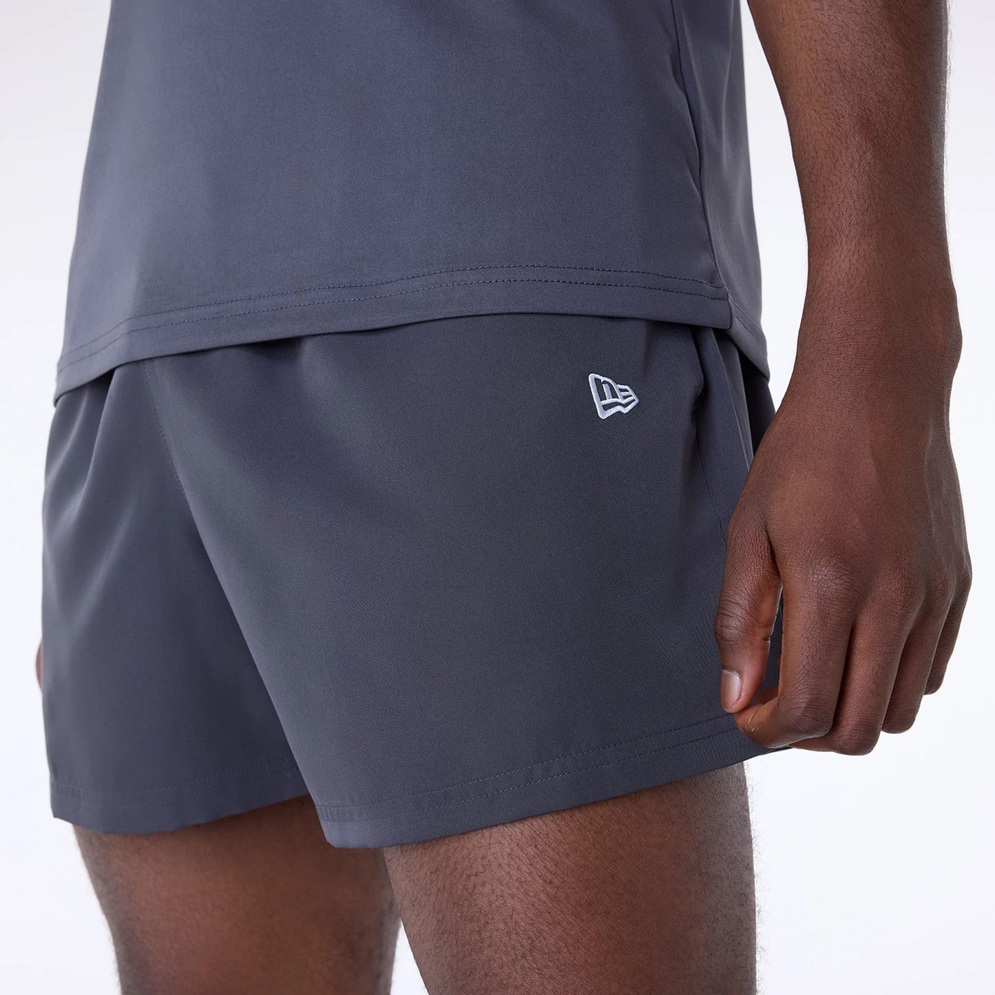 The Male model is wearing Kansas City Chiefs NFL Essentials Dark Grey Shorts 4