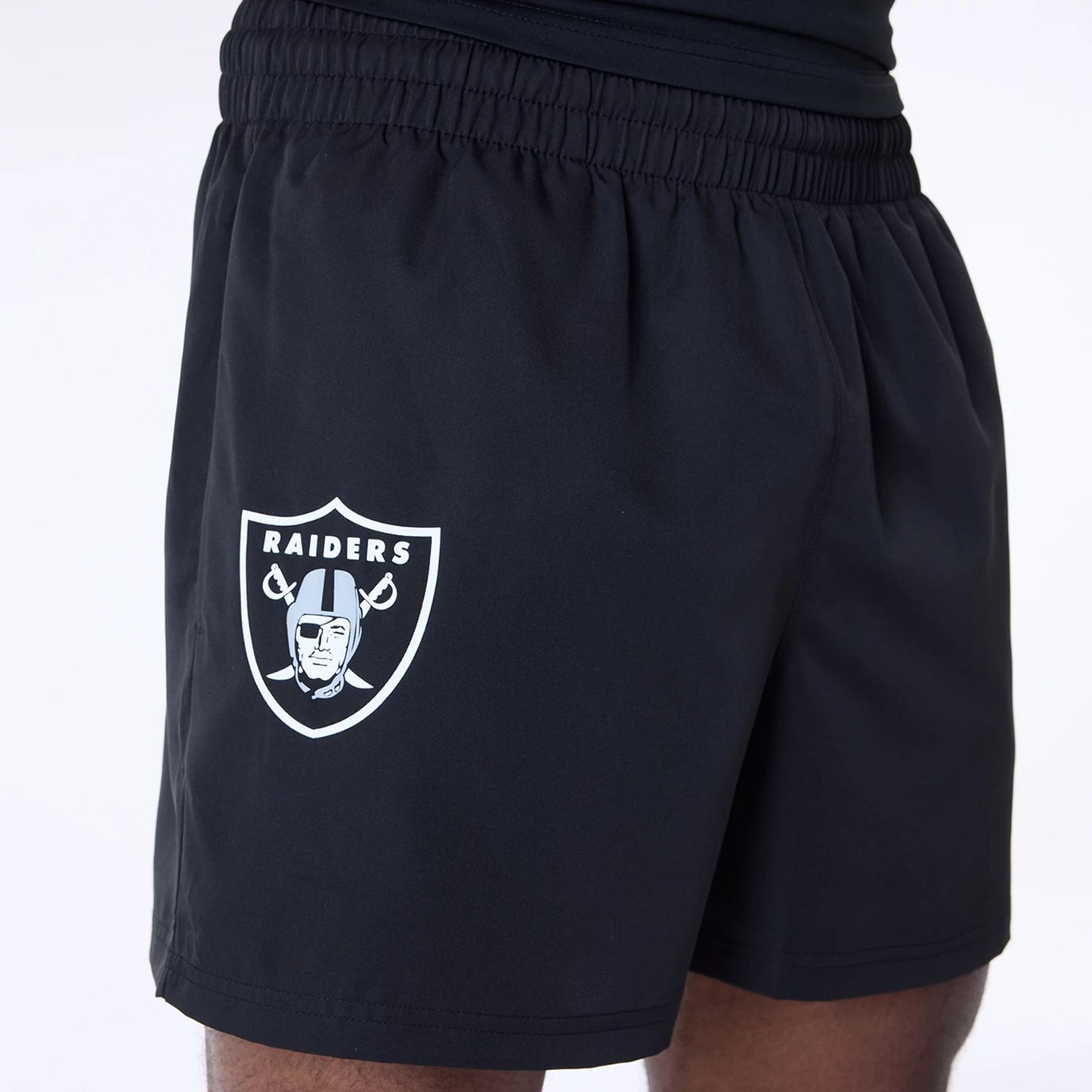 The Male model is wearing Las Vegas Raiders NFL Essentials Black Shorts 5