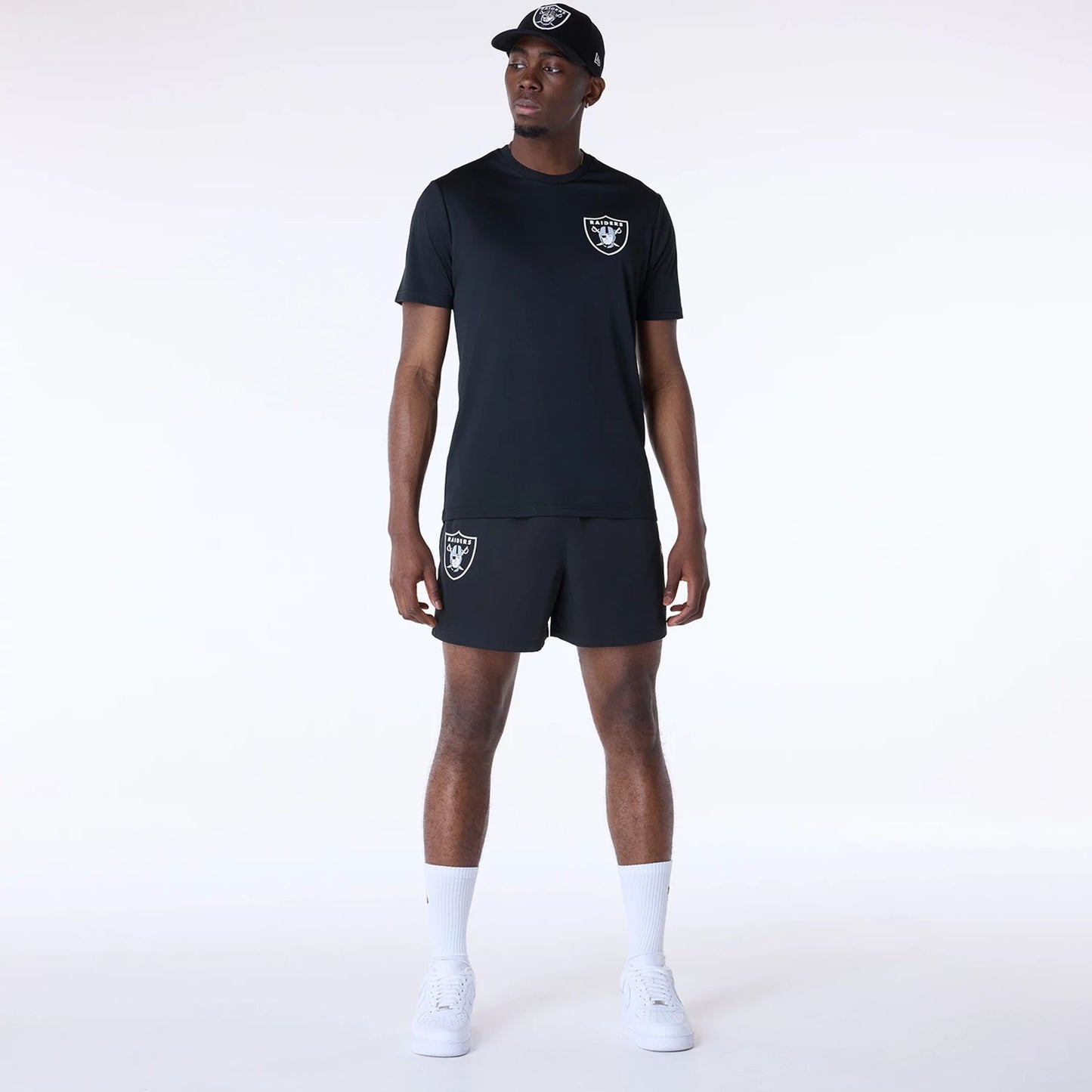 The Male model is wearing Las Vegas Raiders NFL Essentials Black Shorts 3